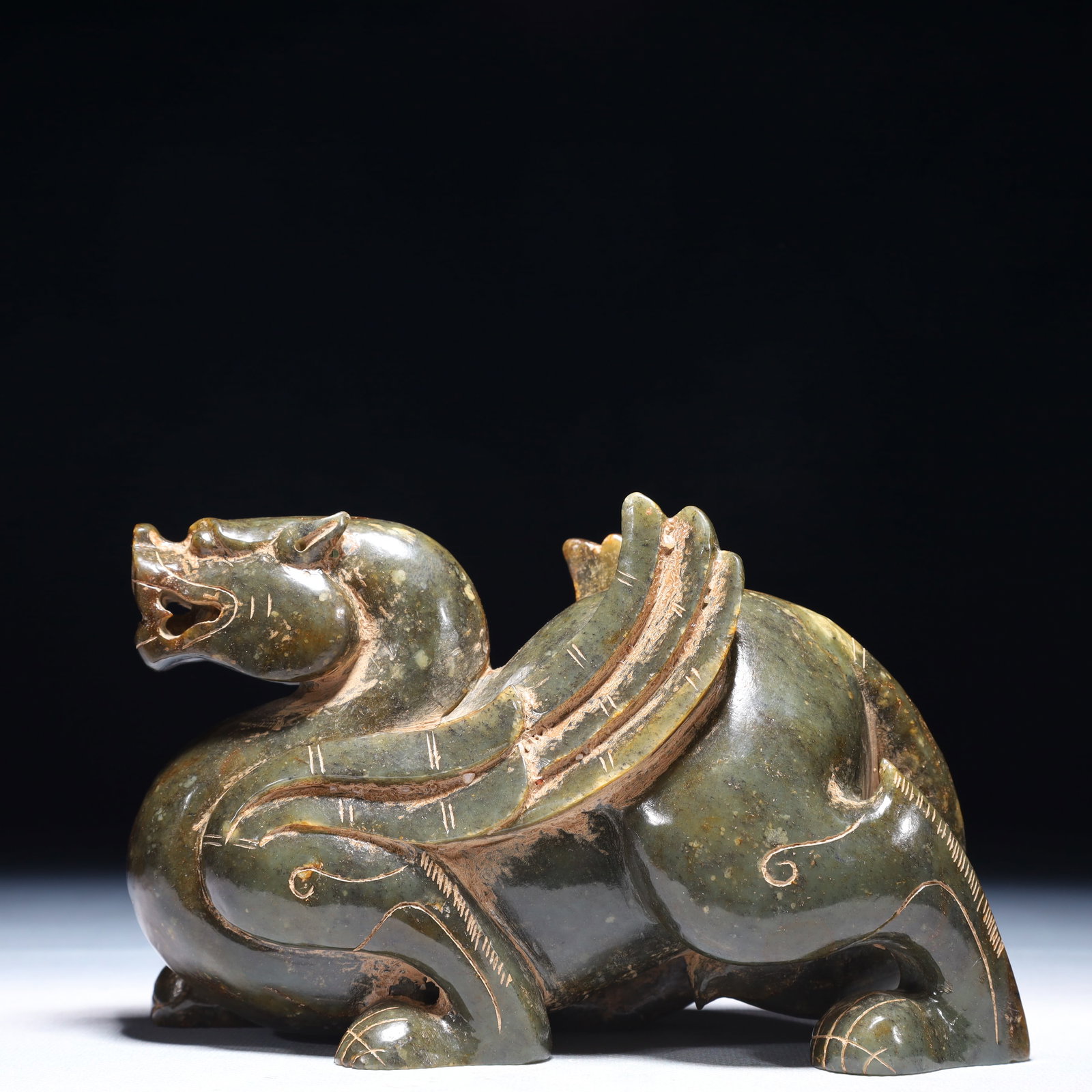 An Exquisite Jasper Auspicious Beast Ornament: An Exquisite Jasper Auspicious Beast Ornament,Qing Dynasty,China,Size:6.7inx2.8inx3.9in,Weight:1500g 碧玉瑞兽摆件,中国清代