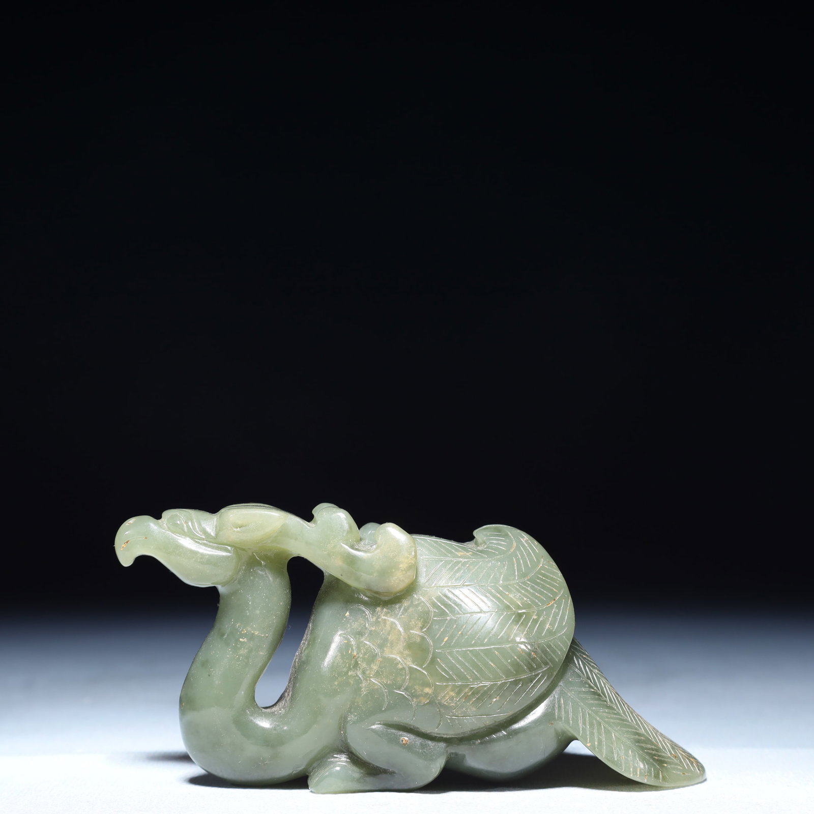 An Exquisite Green Jade Phoenix Ornament: An Exquisite Green Jade Phoenix Ornament,Qing Dynasty,China,Size:4.3inx1.6inx2.2in,Weight:300g 青玉凤摆件,中国清代