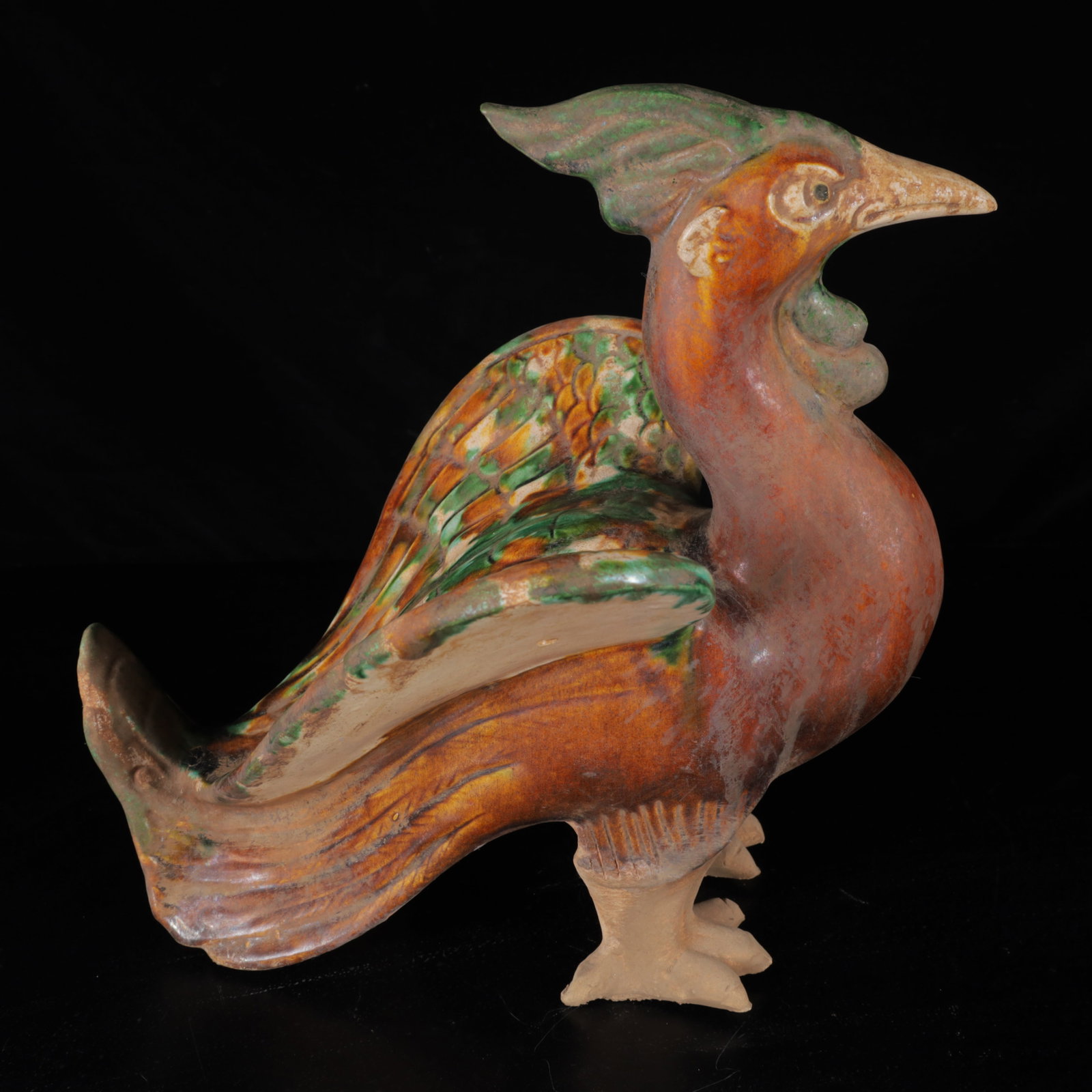 An Exquisite Tang Tri-Color Glazed Pottery Phoenix Pattern Ornament: An Exquisite Tang Tri-Color Glazed Pottery Phoenix Pattern Ornament,Tang Dynasty,China,Size:10.6inx7.9inx11.4in,Weight:2220g 唐三彩凤纹摆件,中国&#