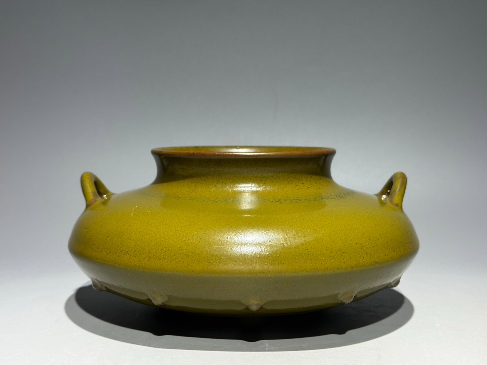 An Exquisite Teadust Glazed Double-Ears and Tripod Censer: An Exquisite Teadust Glazed Double-Ears and Tripod Censer,Qing Dynasty,China,Qianlong Six-character Mark,Size:3.7inx7.1in 茶叶末釉双耳三足香ୀ
