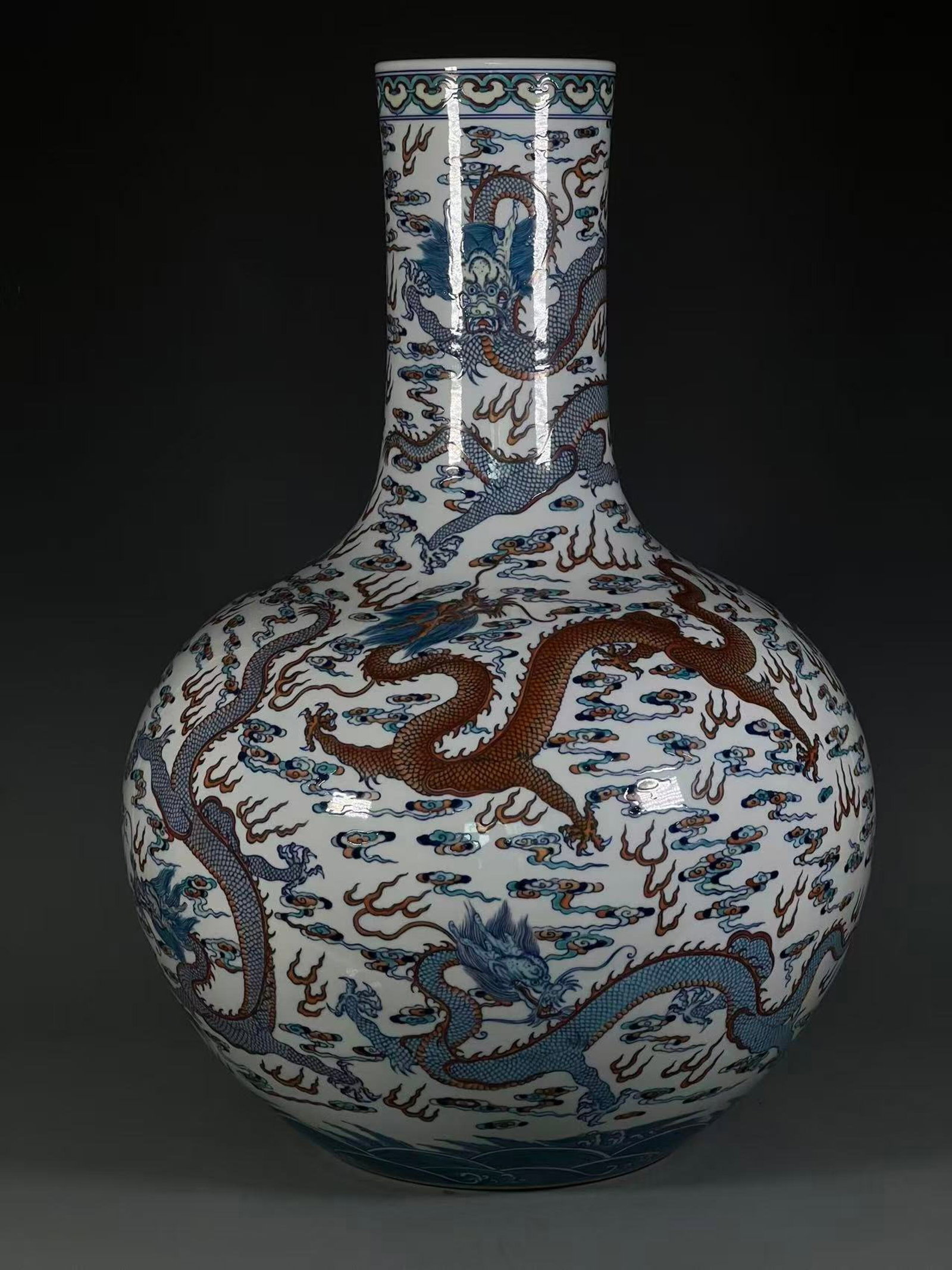A Huge Doucai Auspicious Cloud and Dragon Pattern Vase: A Huge Doucai Auspicious Cloud and Dragon Pattern Vase,Qing Dynasty,China,Qianlong Six-character Mark,Size:23.2inx8.2in 斗彩祥云龙纹瓶,中国清