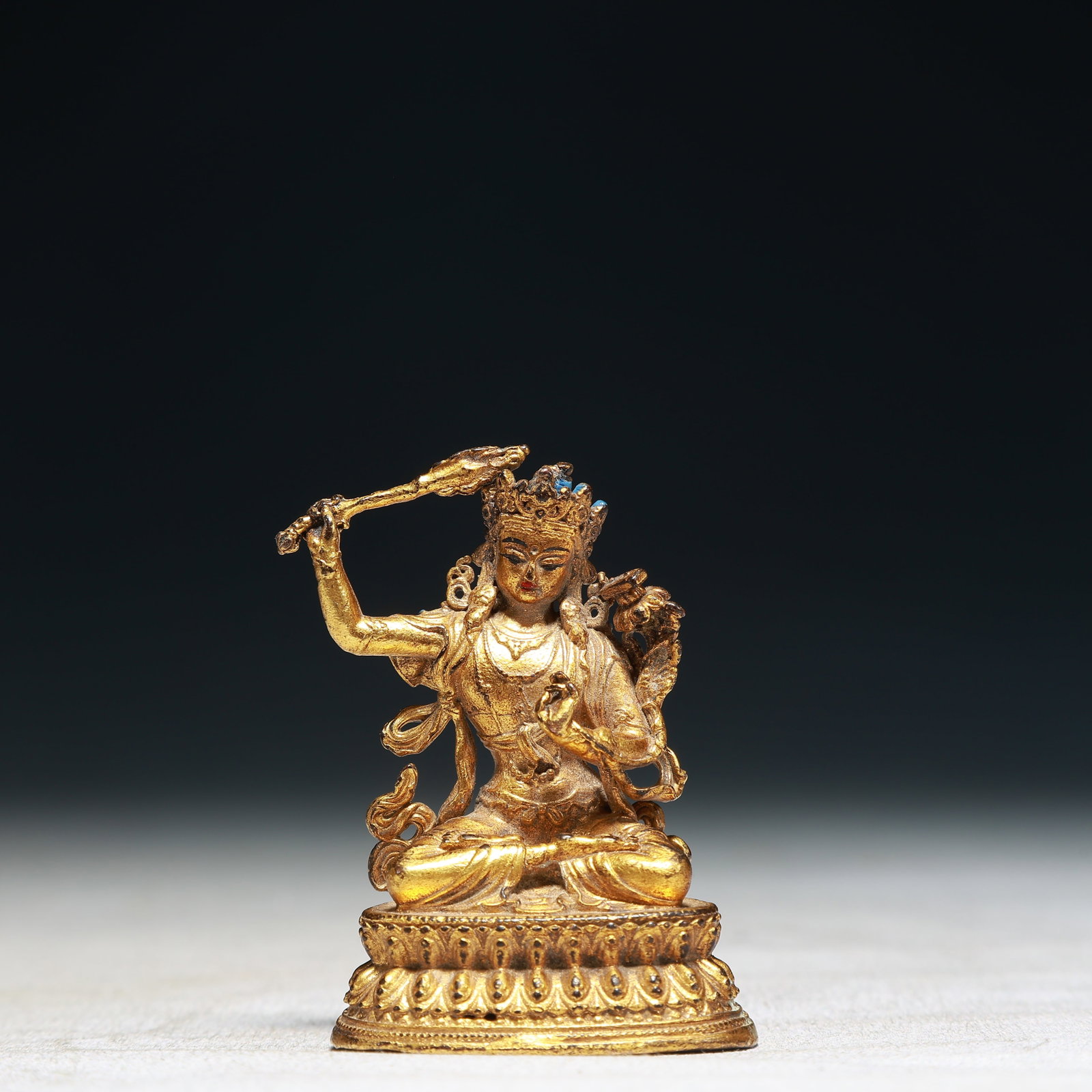 A Solemn Gilt Bronze Statue of Manjusri: A Solemn Gilt Bronze Statue of Manjusri,Qing Dynasty,China,Size:1.6inx1.2inx2.2in,Weight:100g 铜鎏金文殊菩萨像,中国清代
