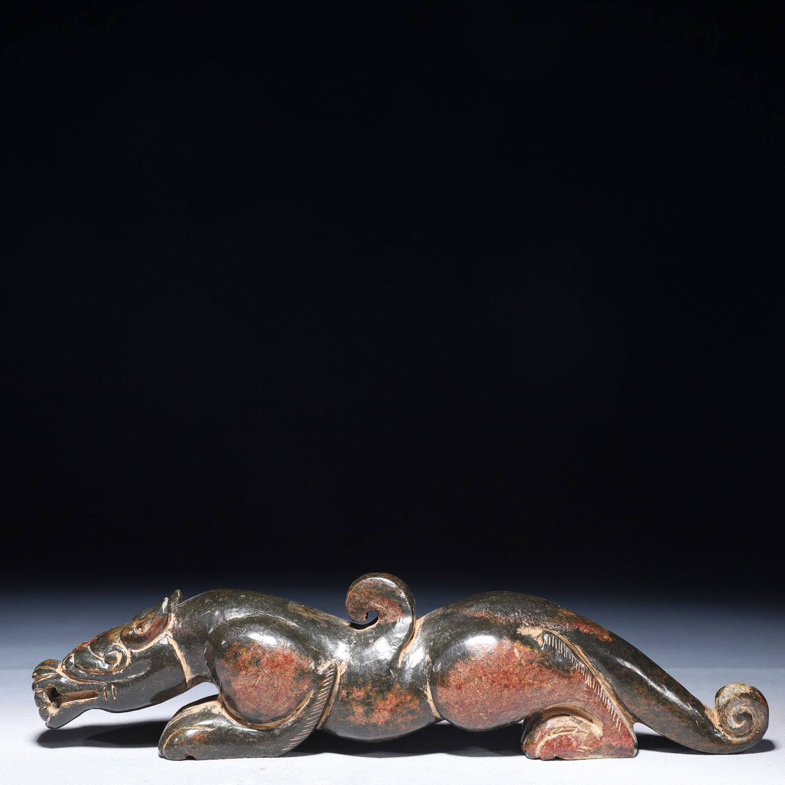 An Exquisite Green Jade Beast Ornament: An Exquisite Green Jade Beast Ornament,Qing Dynasty,China,Size:9.1inx1.6inx2in,Weight:750g 青玉兽摆件,中国清代