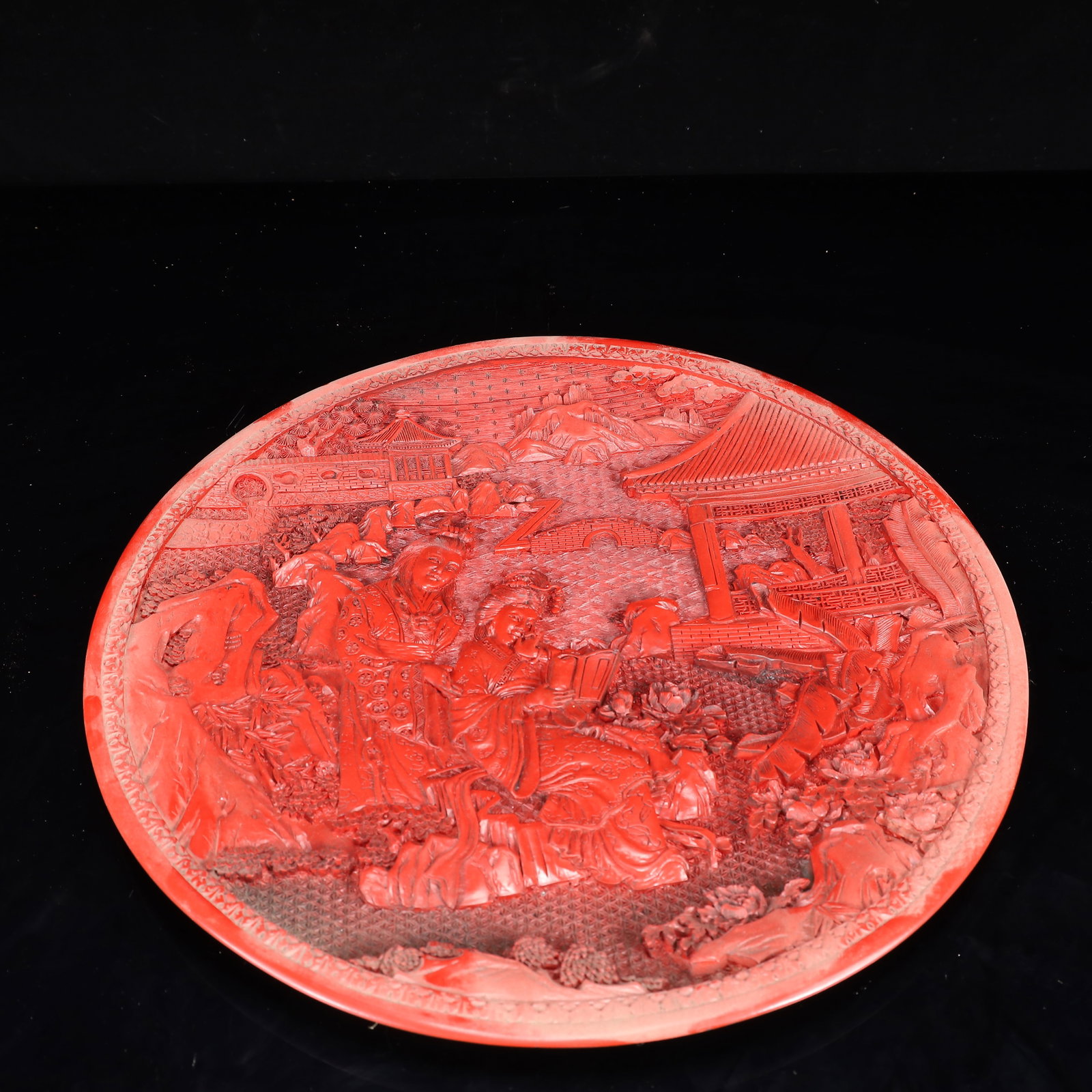 A Rare Carved Red Lacquer Figure Pattern Plate: A Rare Carved Red Lacquer Figure Pattern Plate,Qing Dynasty, China,Qianlong Four-character Mark,Size:14.6inx1.2in,Weight:1550g 剔红漆器人物纹盘,中