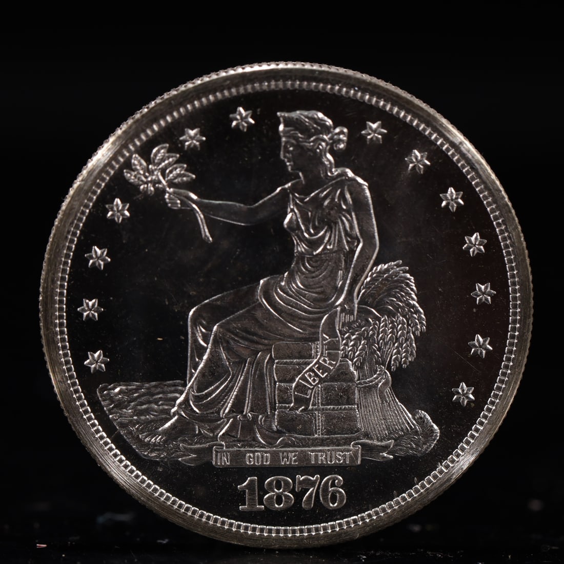 USA Trade Dollar 1876 Coin: American coin. Obverse: Liberty seated on a pedestal facing the sea to the left holding olive branches surrounded by 13 stars. IN GOD WE TRUST / LIBERTY / 1876. Reverse: An eagle holding branches with