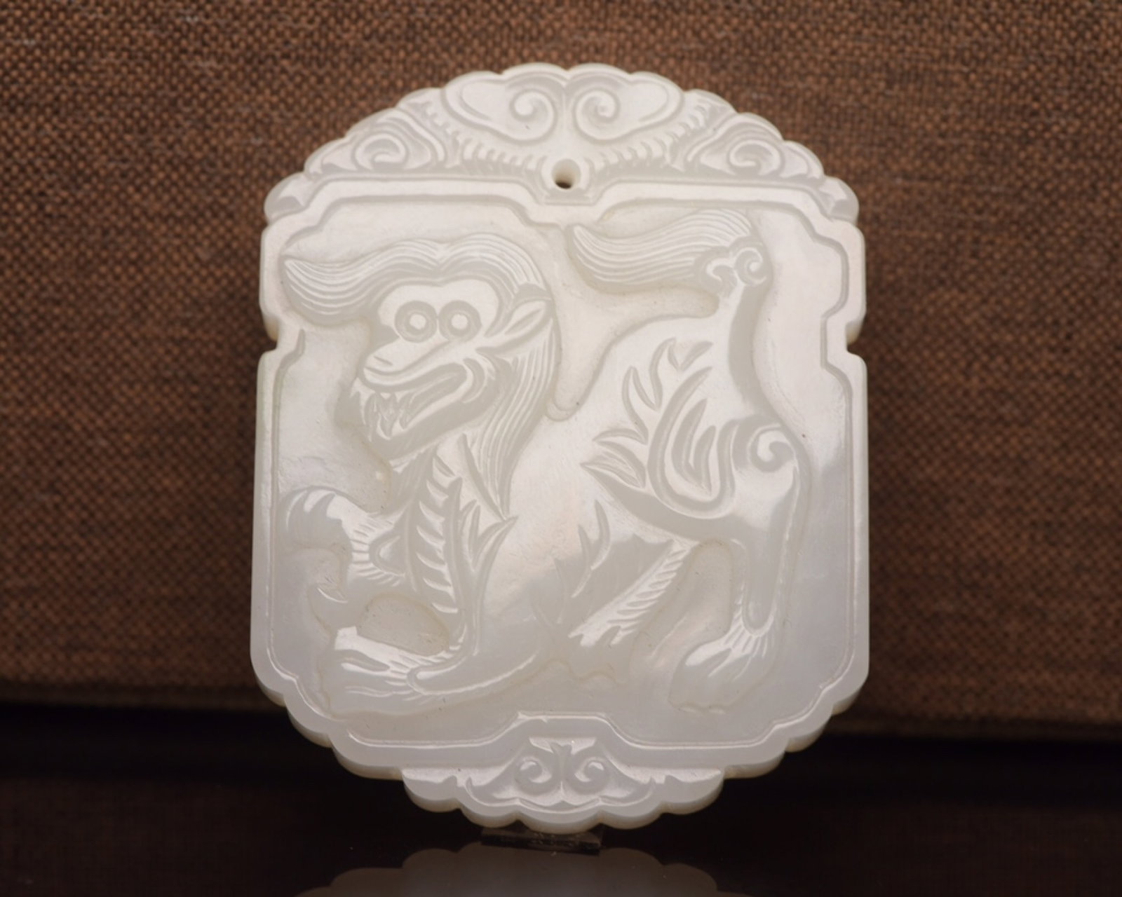 An Exquisite White Jade Beast Pattern Pendant: An Exquisite White Jade Beast Pattern Pendant,Qing Dynasty,China,Size:2.4inx1.9inx0.4in,Weight:62g 白玉兽纹牌,中国清代