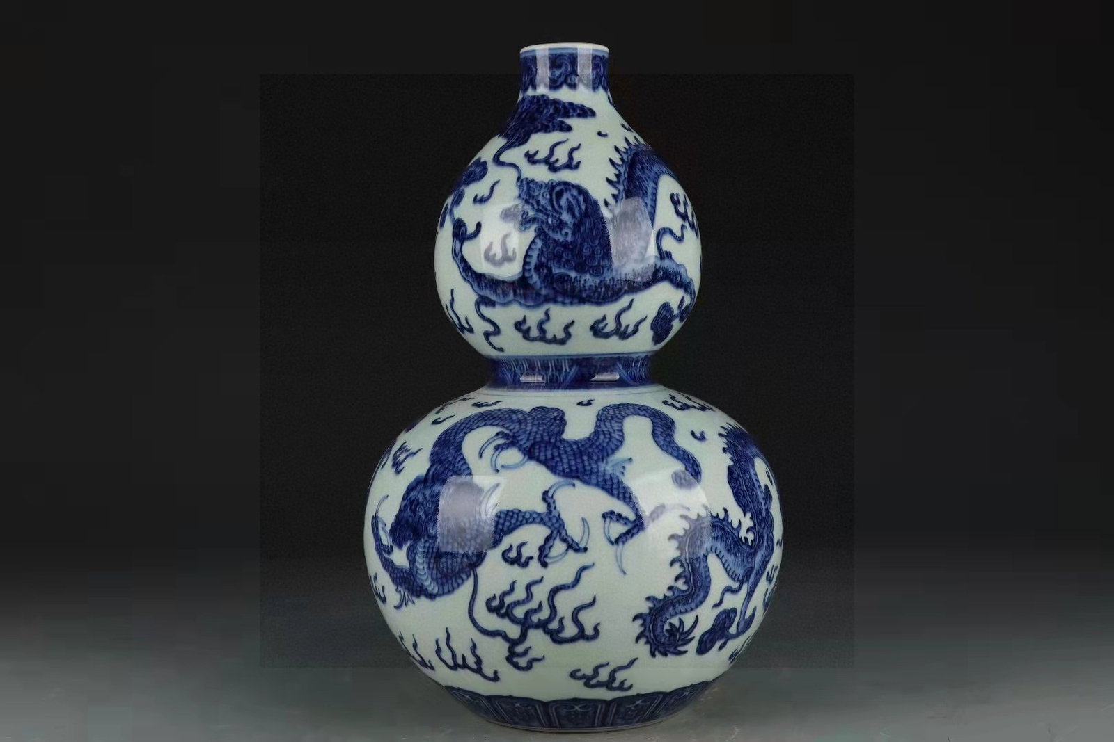 A Rare Blue and White Auspicious Cloud and Dragon Pattern Gourd-Shaped Vase: A Rare Blue and White Auspicious Cloud and Dragon Pattern Gourd-Shaped Vase,Qing Dynasty,China,Qianlong Six-character Mark,Size:13.4inx7.9in