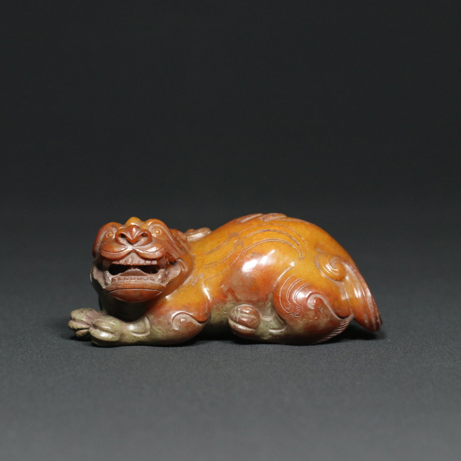 An Exquisite Archaic Jade Auspicious Beast Ornament: An Exquisite Archaic Jade Auspicious Beast Ornament,Han Dynasty,China,Size:3.7inx1.8inx1.5in,Weight:215.8g 高古玉瑞兽摆件,中国汉代