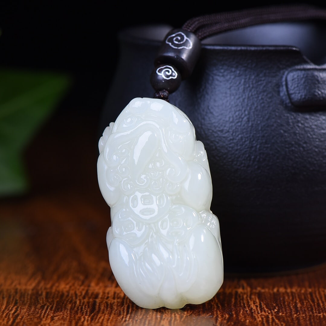 An Exquisite White Jade Wealth-Attracting Creature Pendant: An Exquisite White Jade Wealth-Attracting Creature Pendant,Size:0.9inx1.7in 白玉貔貅挂件