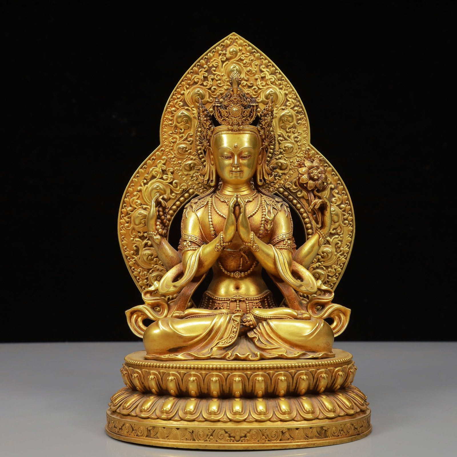 A Solemn Gilt Bronze Four-arms Statue of Avalokitesvara: A Solemn Gilt Bronze Four-arms Statue of Avalokitesvara,Qing Dynasty, China,Size:5.5inx4.3inx8.9in,Weight:1950g 铜鎏金四臂观音像,中国清