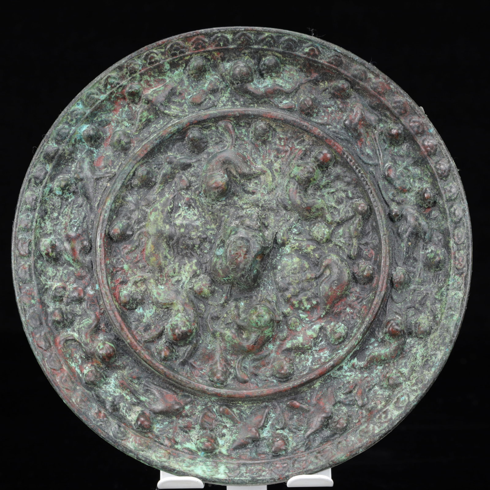 An Archaic Bronze Animal Pattern Round Mirror: An Archaic Bronze Animal Pattern Round Mirror,The Warring States period in China,Size:6.3inx0.6in,Weight:850g