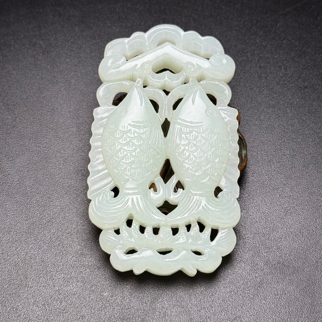 An Exquisite White Jade Hollow Fish Pattern Pendant: An Exquisite White Jade Hollow Fish Pattern Pendant,Qing Dynasty,China,Size:81mmx47mmx10mm,Weight:62g 白玉镂空鱼纹挂件,中国清代
