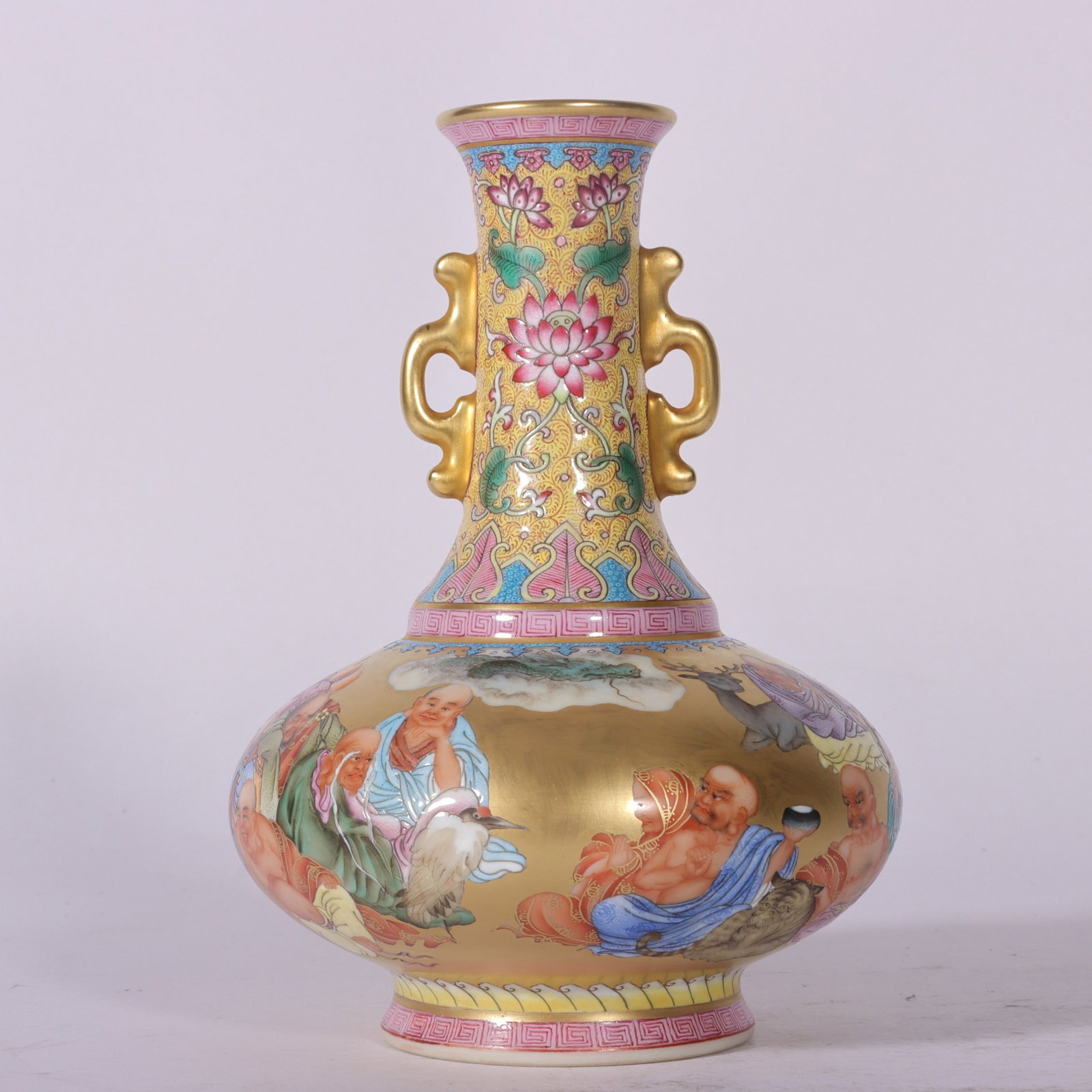 An Exquisite Enamel Gold Ground Arhat Pattern Double-Ears Vase: An Exquisite Enamel Gold Ground Arhat Pattern Double-Ears Vase,Qing Dynasty, China,Qianlong Six-character Mark,Size:6.3inx1.6inx4.3inx2.4in