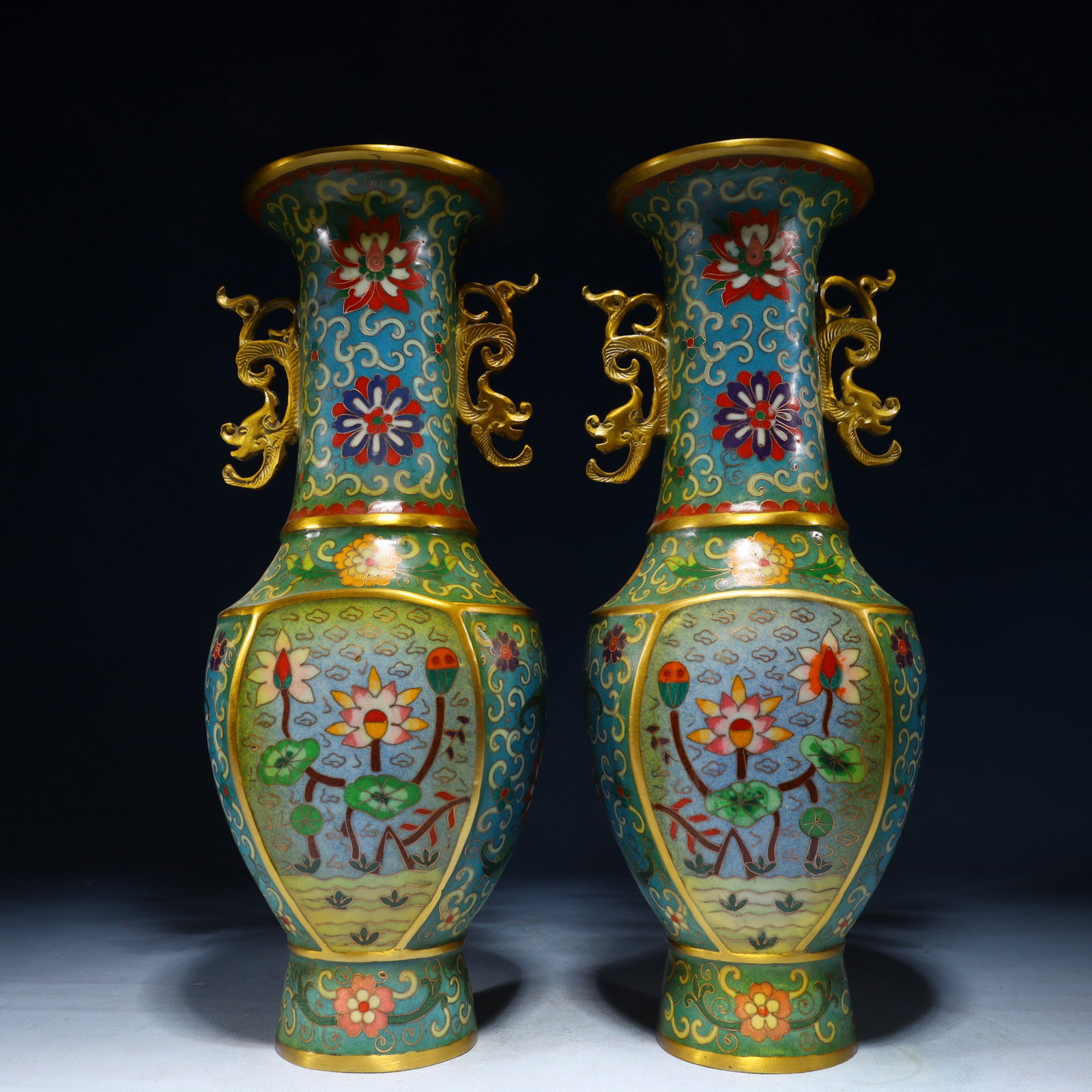 A Pair of Exquisite Cloisonne Lotus Pattern Double-Ears Vases: A Pair of Exquisite Cloisonne Lotus Pattern Double-Ears Vases,Qing Dynasty,China,Qianlong Four-character Mark,Size:5.9inx4.7inx14.8in,Weight:5050g