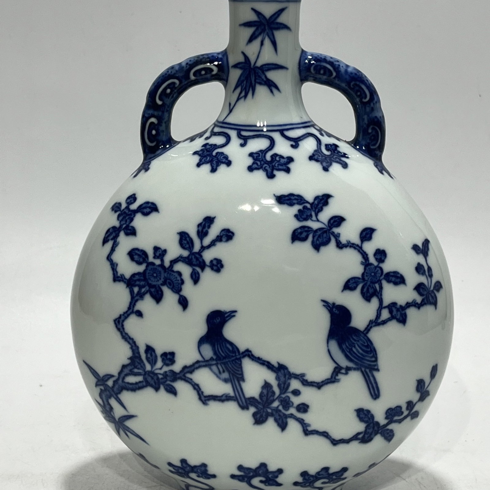 An Exquisite Blue and White Flower and Bird Pattern Double-Ears Vase: An Exquisite Blue and White Flower and Bird Pattern Double-Ears Vase,Qing Dynasty,China,Qianlong Six-character Mark,Size:10.6in