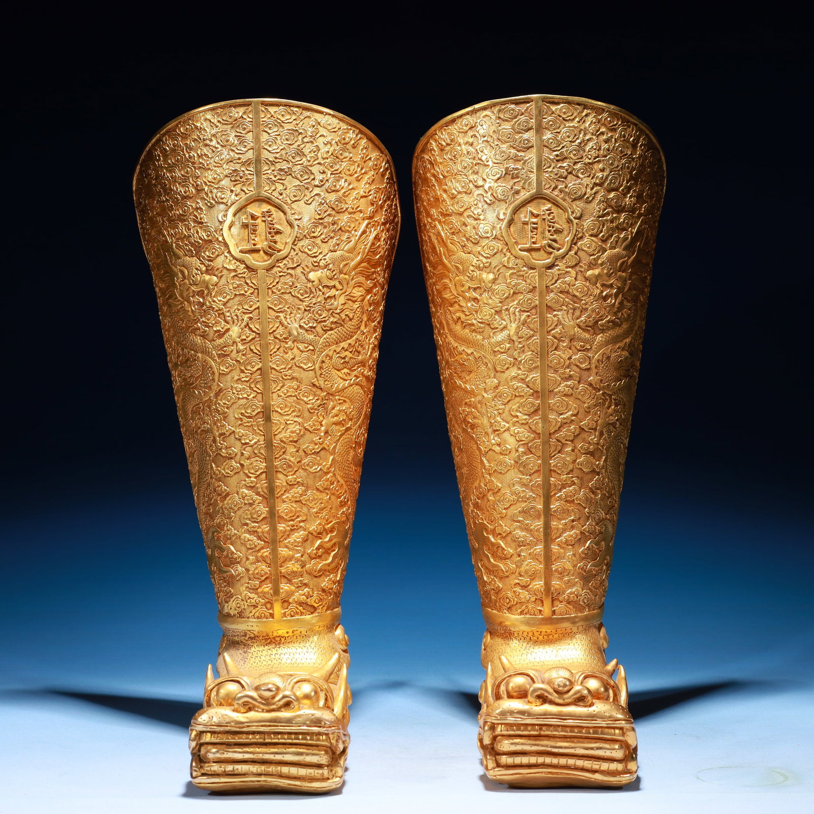A Pair of Exquisite Gilt Bronze Dragon Pattern Boots: A Pair of Exquisite Gilt Bronze Dragon Pattern Boots,Qing Dynasty,China,Size:8.7inx3.9inx17.3in,Weight:7450g 一对铜鎏金龙纹靴子,中国&#