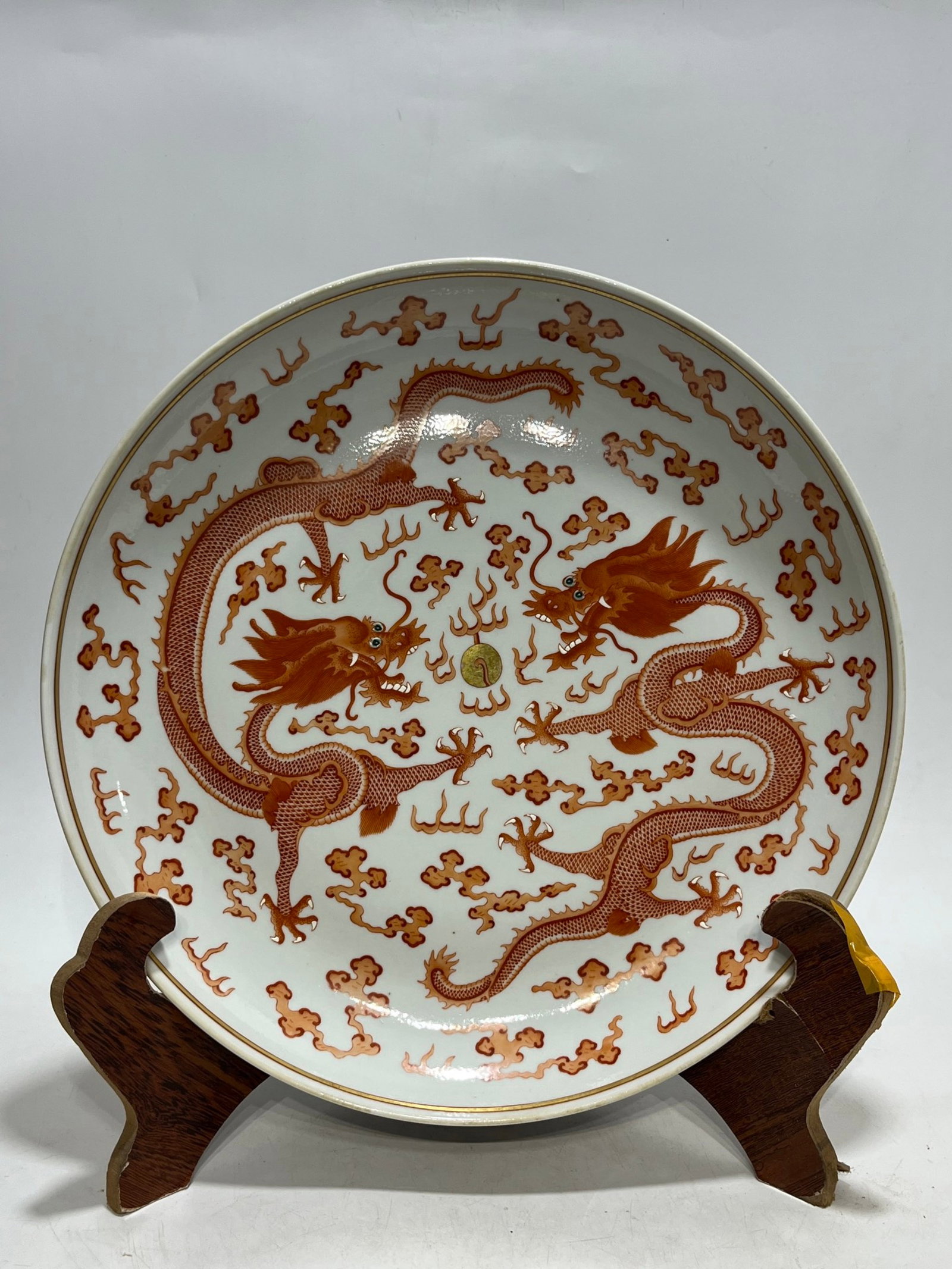 A Rare Iron-Red Painted Gold Auspicious Cloud and Dragon Pattern Plate: A Rare Iron-Red Painted Gold Auspicious Cloud and Dragon Pattern Plate,Qing Dynasty,China,Guangxu Six-character Mark,Size:13.6in