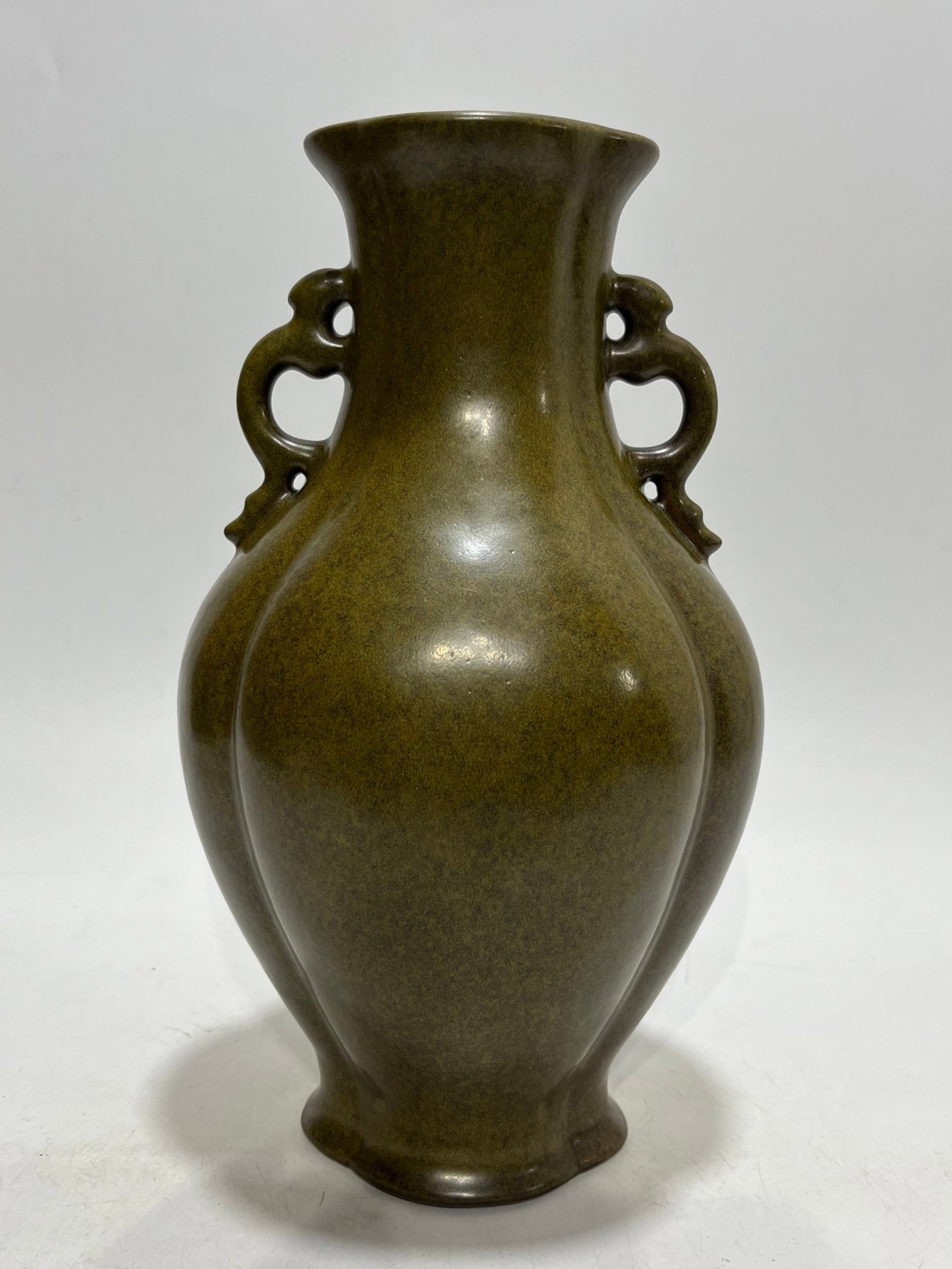 A Rare Teadust Glazed Double-Ears Vase: A Rare Teadust Glazed Double-Ears Vase,Qing Dynasty,China,Qianlong Four-character Mark,Size:12.4in 茶叶末釉双耳瓶,中国清代,乾