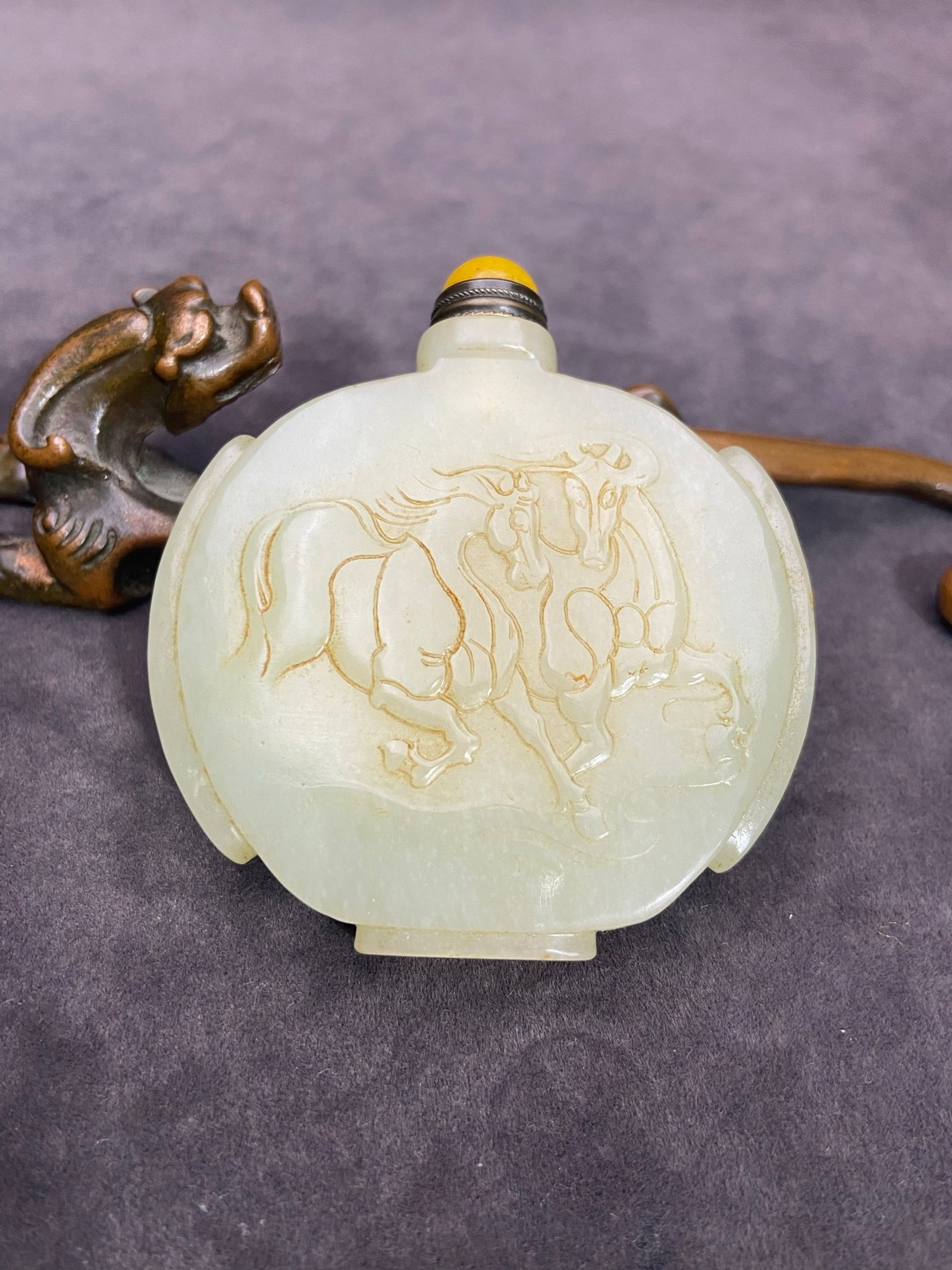 An Exquisite White Jade Horse Pattern Snuff Bottle: An Exquisite White Jade Horse Pattern Snuff Bottle,Qing Dynasty,China,Size:66.8mmx66mmx14mm,Weight:72g 白玉马纹鼻烟壶,中国清代