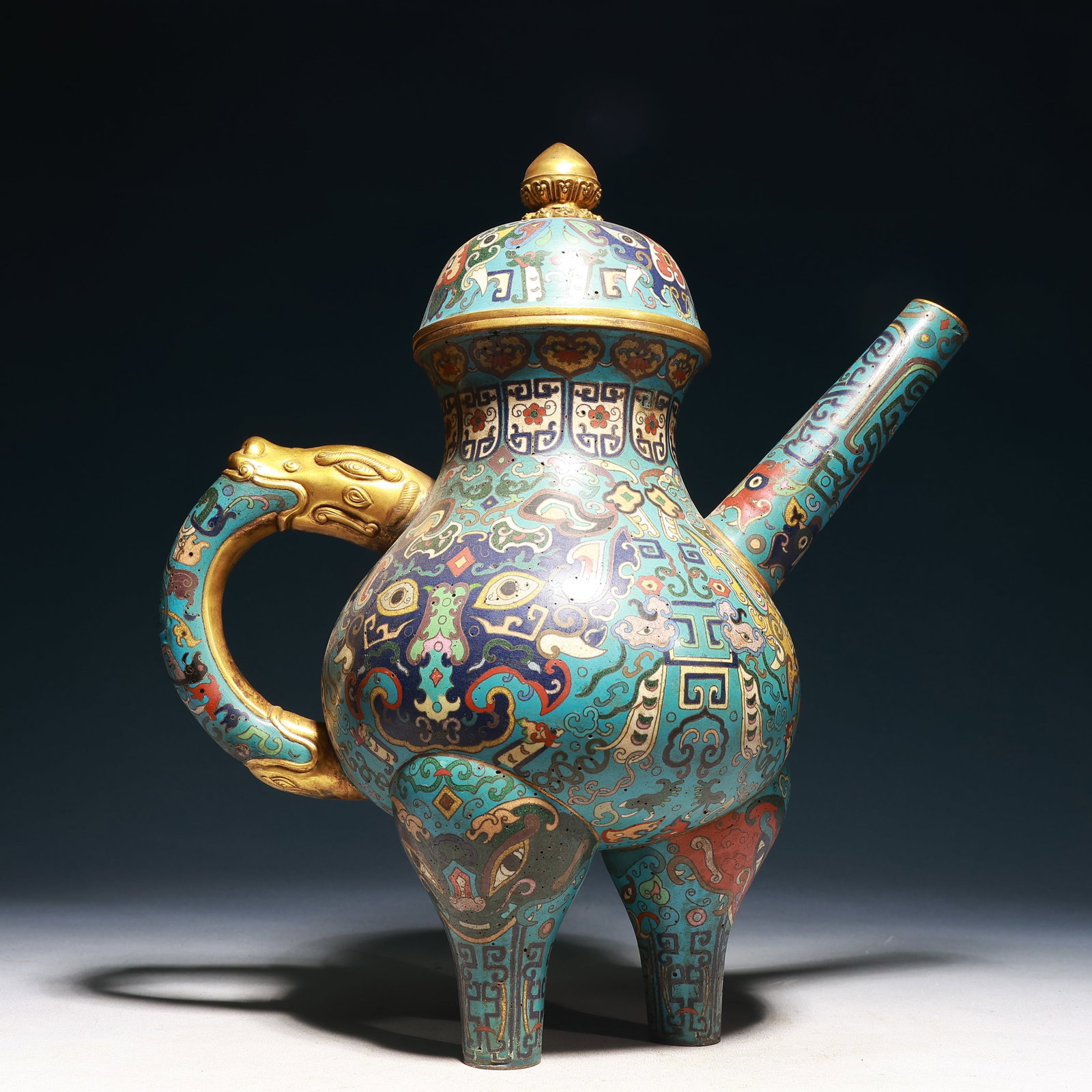 A Huge Cloisonne Beast-Face Pattern Tripod Teapot: A Huge Cloisonne Beast-Face Pattern Tripod Teapot,Qing Dynasty,China,Qianlong Four-character Mark,Size:13.8inx7.5inx15.7in,Weight:3200g