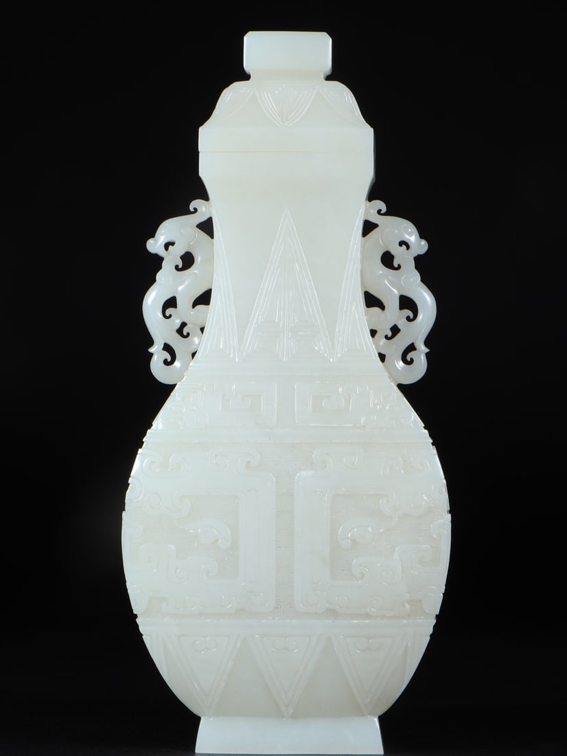 An Exquisite White Jade Taotie Pattern Phoenix-Ears Bottle: An Exquisite White Jade Taotie Pattern Phoenix-Ears Bottle ,Qing Dynasty, China,Size:3.7inx1.9inx8.1in,Weight:532g 白玉饕餮纹凤耳盖瓶 ,中