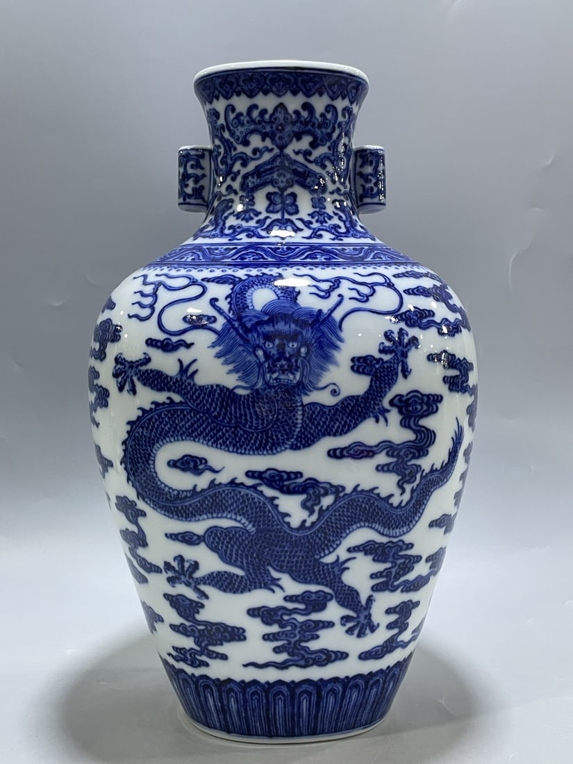 A Rare Blue and White Auspicious Cloud and Dragon Pattern Double-Ears Vase: A Rare Blue and White Auspicious Cloud and Dragon Pattern Double-Ears Vase,Qing Dynasty,China,Qianlong Six-character Mark,Size:13.4inx9.8in