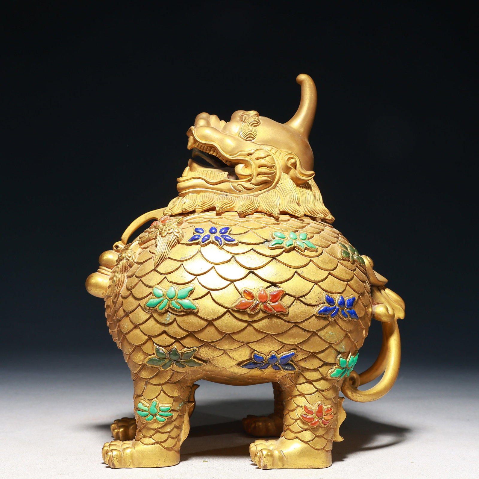 An Exquisite Gilt Bronze Inlaid Gems Unicorn Ornament: An Exquisite Gilt Bronze Inlaid Gems Unicorn Ornament,Qing Dynasty,China,Size:7.9inx4.7inx9.8in,Weight:5000g