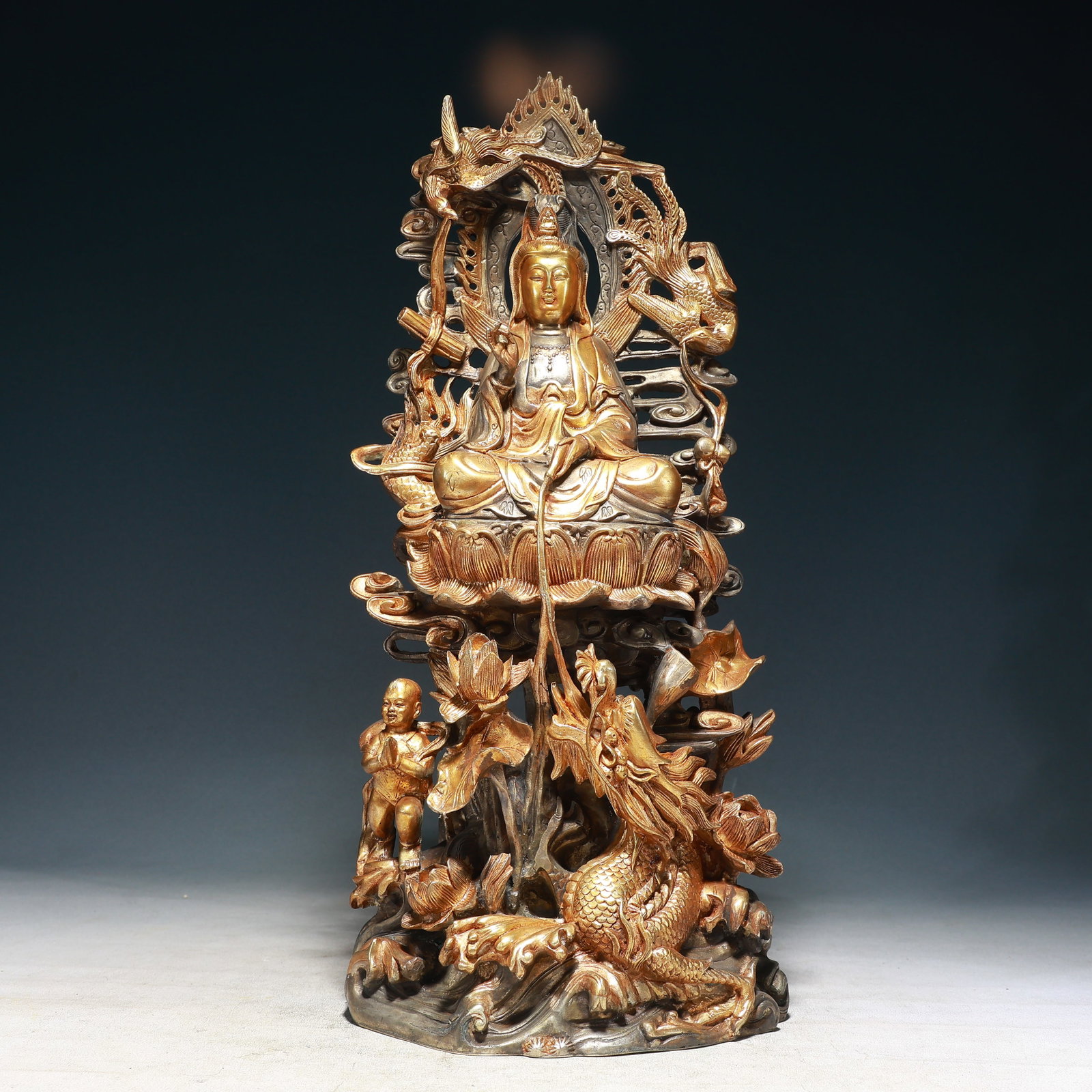A Solemn Silver-Gilt Bronze Dragon and Phoenix Statue of Avalokitesvara: A Solemn Silver-Gilt Bronze Dragon and Phoenix Statue of Avalokitesvara,Ming Dynasty,China,Yongle Six-character Mark,Size:8.7inx3.9inx18.1in,Weight:7350g
