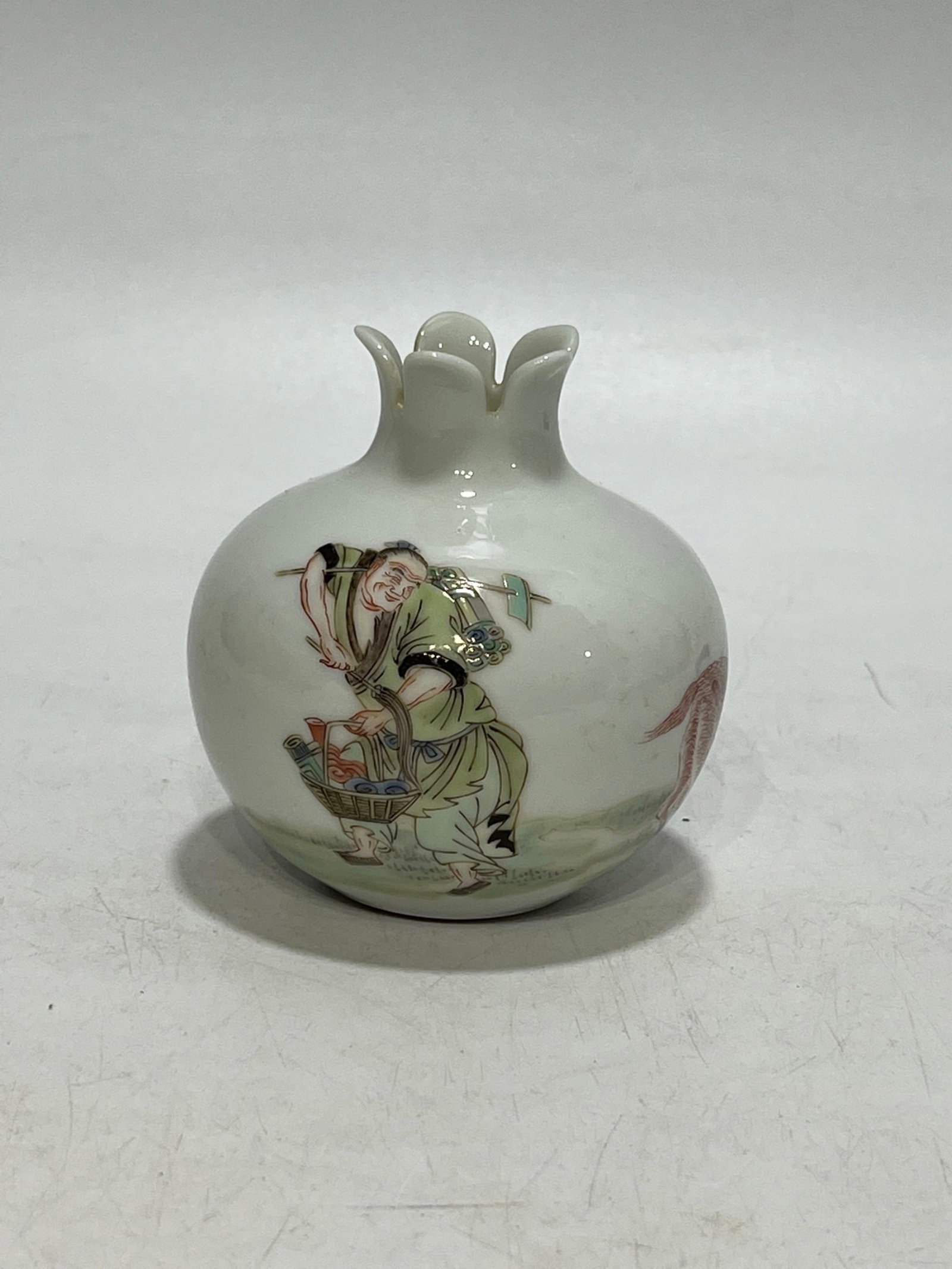 An Exquisite Wucai Figure Pattern Pomegranate-Shaped Jar (1 of 9)