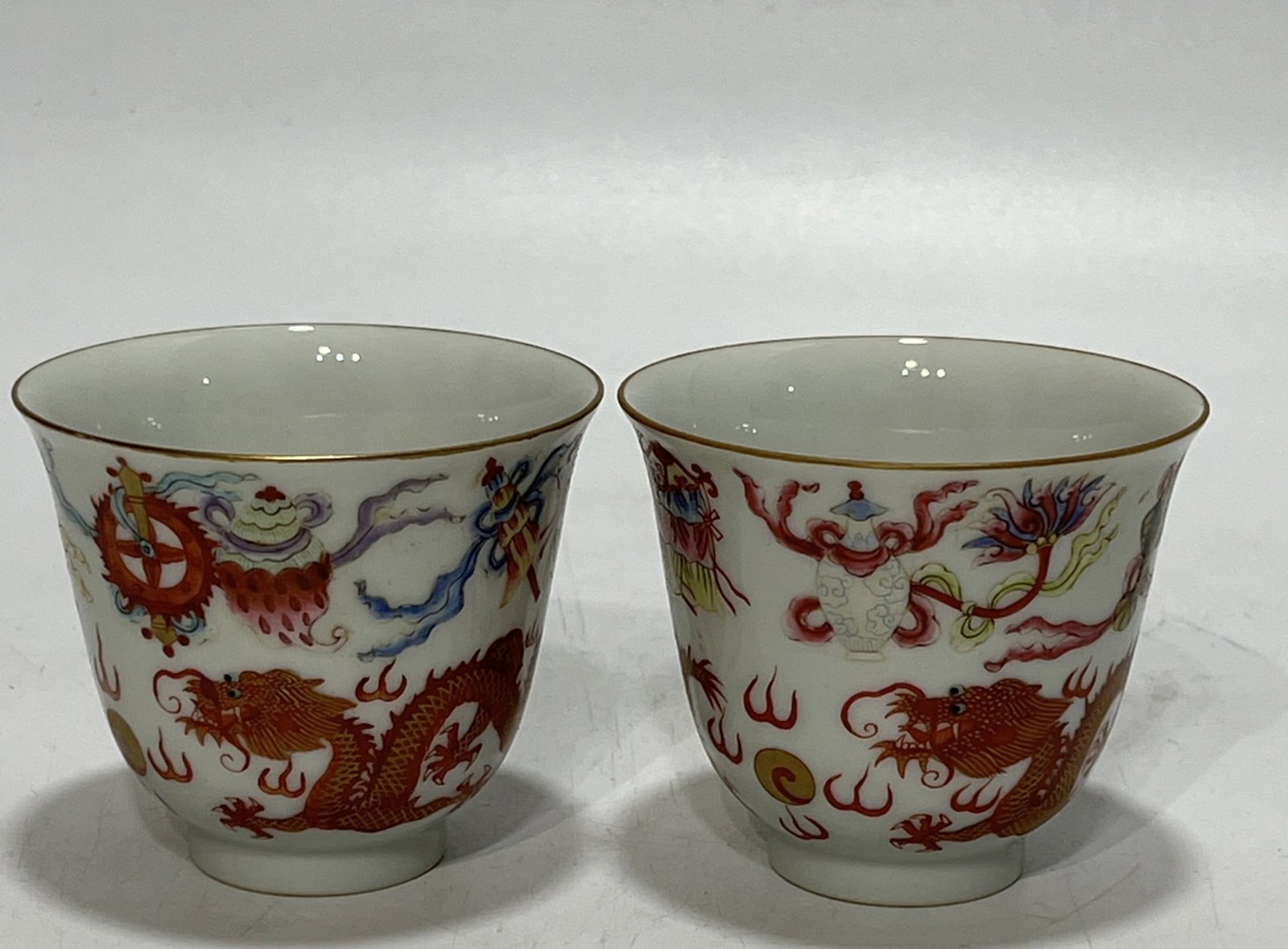 A Pair of Exquisite Famille-Rose Painted Gold Eight Treasures and Dragon Pattern Pattern Cups: A Pair of Exquisite Famille-Rose Painted Gold Eight Treasures and Dragon Pattern Pattern Cups,Qing Dynasty,China,Guangxu Six-character Mark,Size:2.9in