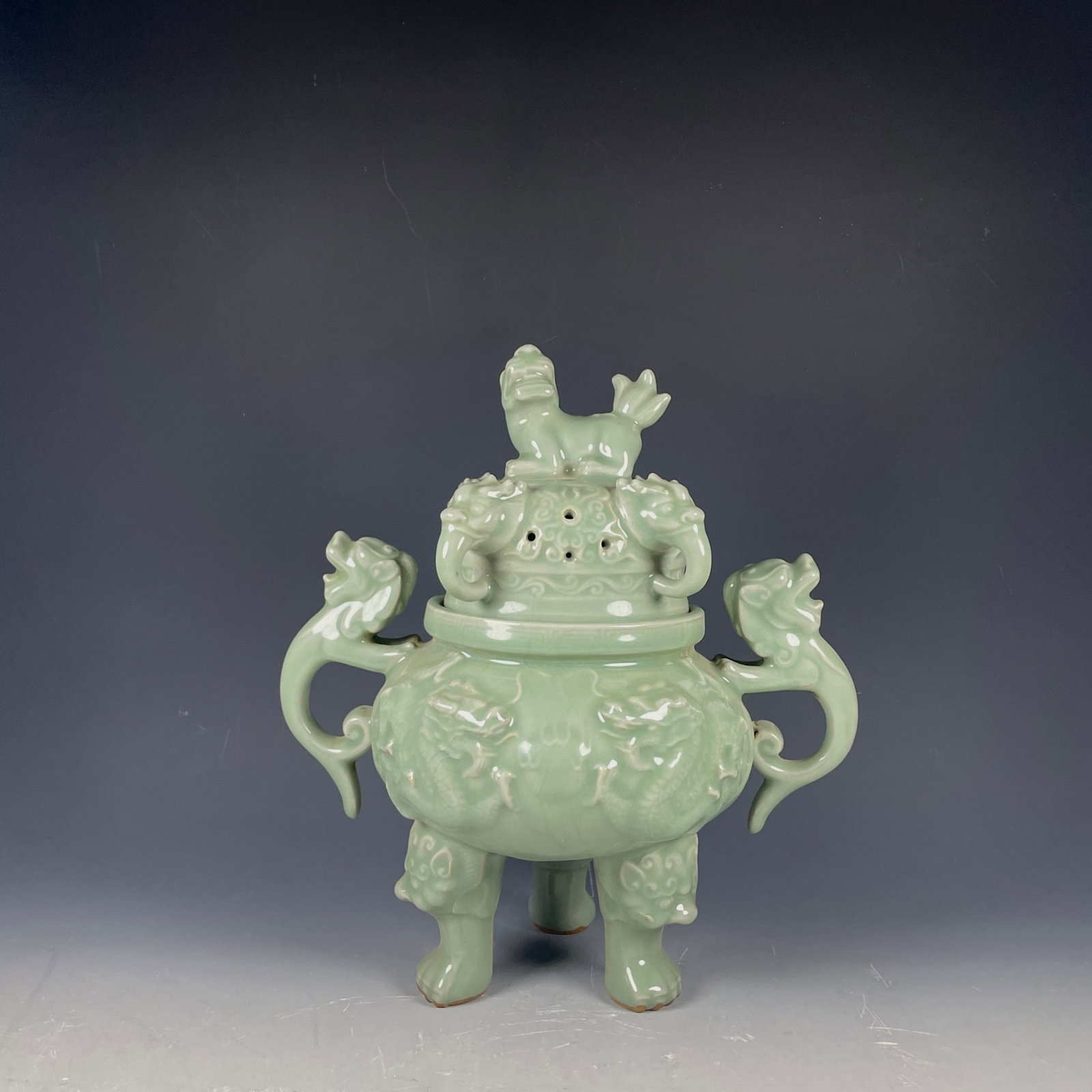 A Rare Longquan yao Celadon Glazed Auspicious Cloud and Dragon Pattern Double-Ears and Tripod Censer (1 of 9)