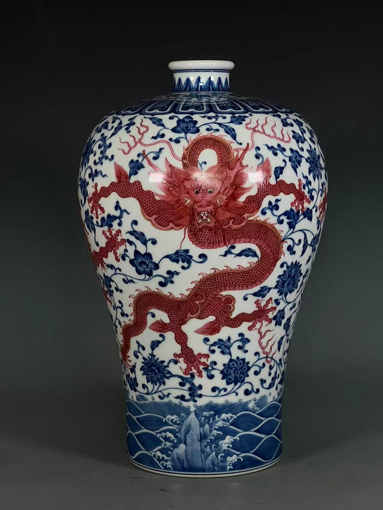 A Rare Blue and White Iron-Red Lotus,Seawater and Dragon Pattern Vase: A Rare Blue and White Iron-Red Lotus,Seawater and Dragon Pattern Vase,Qing Dynasty,China,Qianlong Six-character Mark,Size:14.9inx2.4inx5.9in 青花矾红釉缠枝