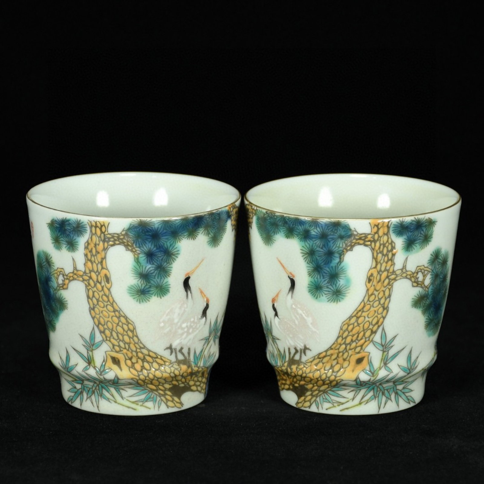 A Pair of Exquisite Famille-Rose Pine and Crane Pattern Cups: A Pair of Exquisite Famille-Rose Pine and Crane Pattern Cups,Qing Dynasty,China,Yongzheng Four-character Mark,Size:3inx3.1in 一对粉彩松鹤纹杯子,&#