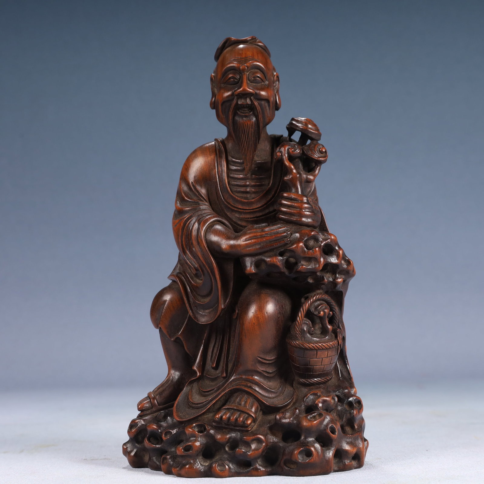 An Exquisite Zitanwood Figure Ornament: An Exquisite Zitanwood Figure Ornament,Qing Dynasty, China,Size:4.3inx3.7inx7.9in,Weight:250g 紫檀木人物摆件,中国清代