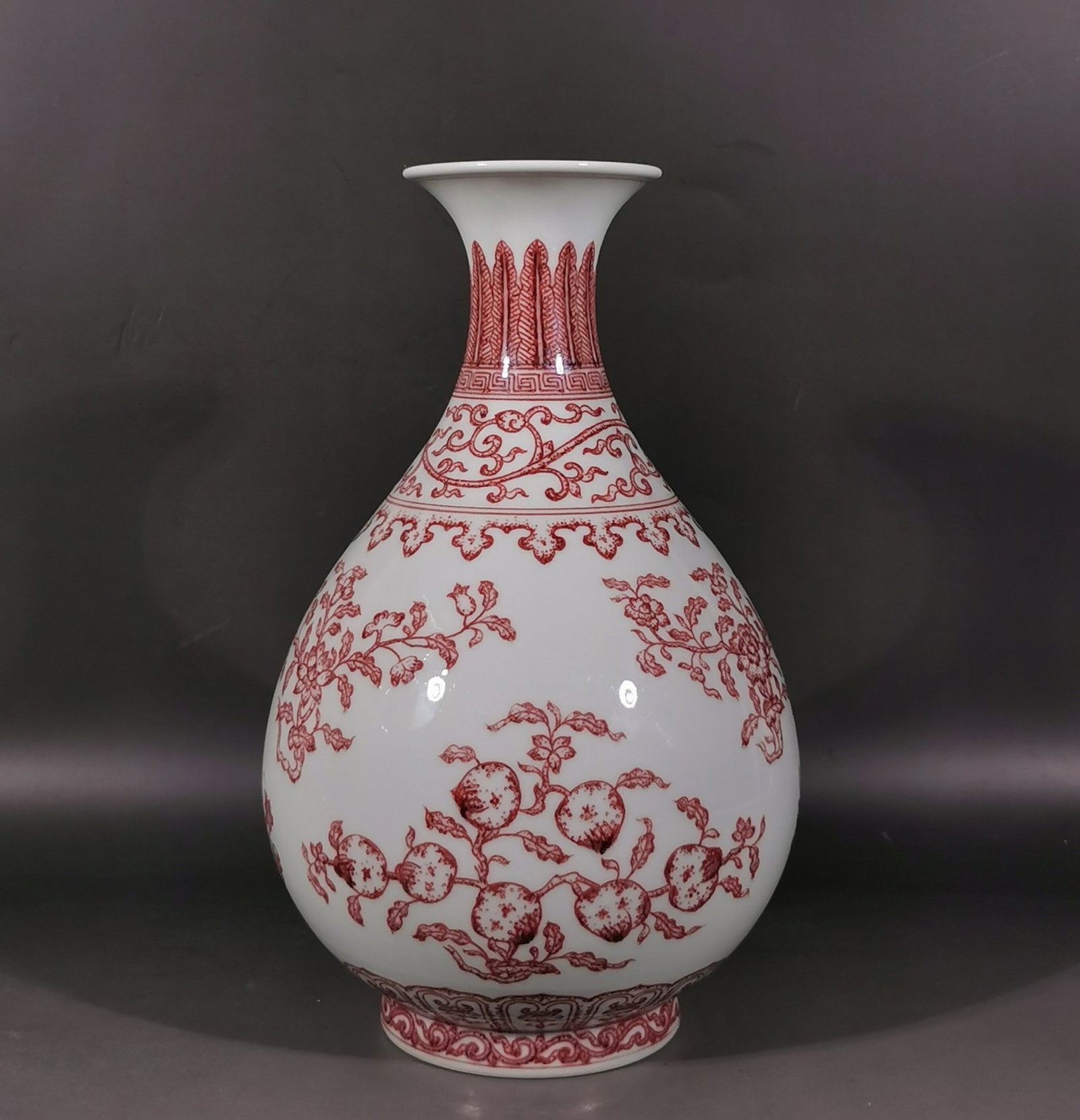 A Rare Underglaze-Red Flower and Fruit Pattern Vase: A Rare Underglaze-Red Flower and Fruit Pattern Vase,Qing Dynasty,China,Yongzheng Six-character Mark,Size:11.8inx3.5inx7.2in 釉里红花果纹瓶,中国