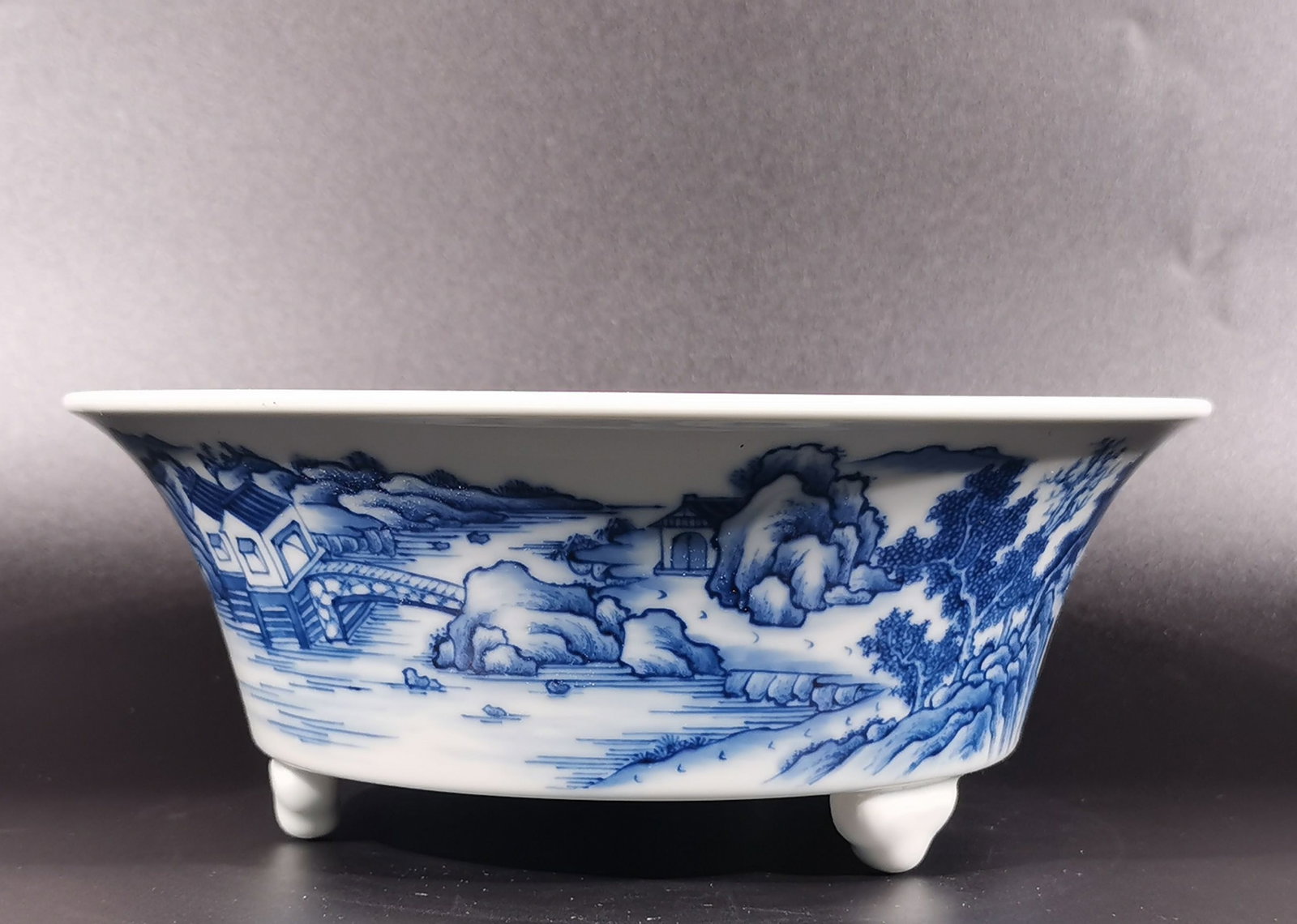 An Exquisite Blue and White Landscape and Figure Pattern Tripod Water Pot: An Exquisite Blue and White Landscape and Figure Pattern Tripod Water Pot,Qing Dynasty, China,Yongzheng Six-character Mark,Size:3.1inx8.3in 青花山水人物纹