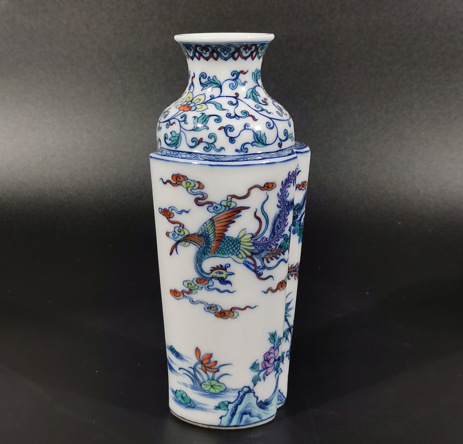 An Exquisite Blue and White Doucai Lotus and Phoenix Pattern Vase: An Exquisite Blue and White Doucai Lotus and Phoenix Pattern Vase,Qing Dynasty, China,Yongzheng Six-character Mark,Size:6.3inx1.6inx2.9in 青花斗彩缠枝莲࠰