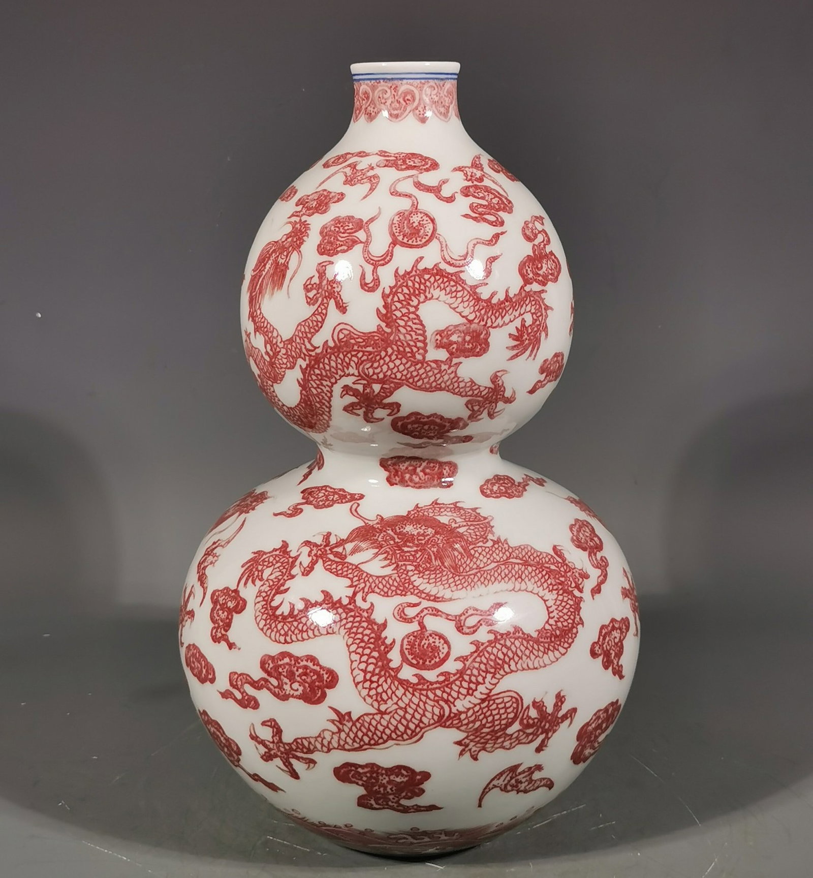 A Rare Underglaze-Red Auspicious Cloud and Dragon Pattern Gourd-Shaped Vase: A Rare Underglaze-Red Auspicious Cloud and Dragon Pattern Gourd-Shaped Vase,Qing Dynasty, China,Qianlong Six-character Mark,Size:11.8inx7.3in 釉里红祥云龙纹&#