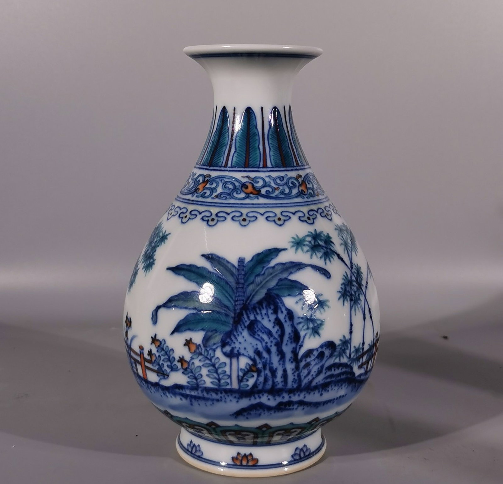 An Exquisite Blue and White Doucai Banana Leaf and Bamboo Pattern Vase: An Exquisite Blue and White Doucai Banana Leaf and Bamboo Pattern Vase,Qing Dynasty, China,Qianlong Six-character Mark,Size:6.4inx4.3inx2.2in