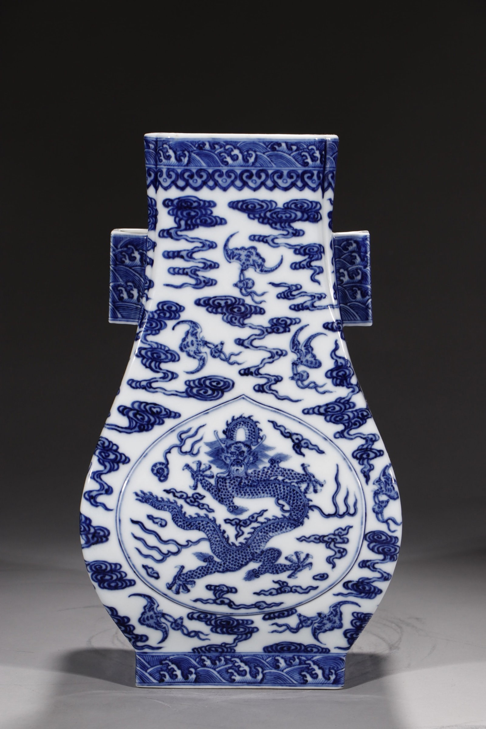 A Rare Blue and White Auspicious Cloud,Bats and Dragon Pattern Double-Ears Vase: A Rare Blue and White Auspicious Cloud,Bats and Dragon Pattern Double-Ears Vase,Qing Dynasty,China,Qianlong Six-character Mark,Size:14in 青花祥云蝙蝠龙纹