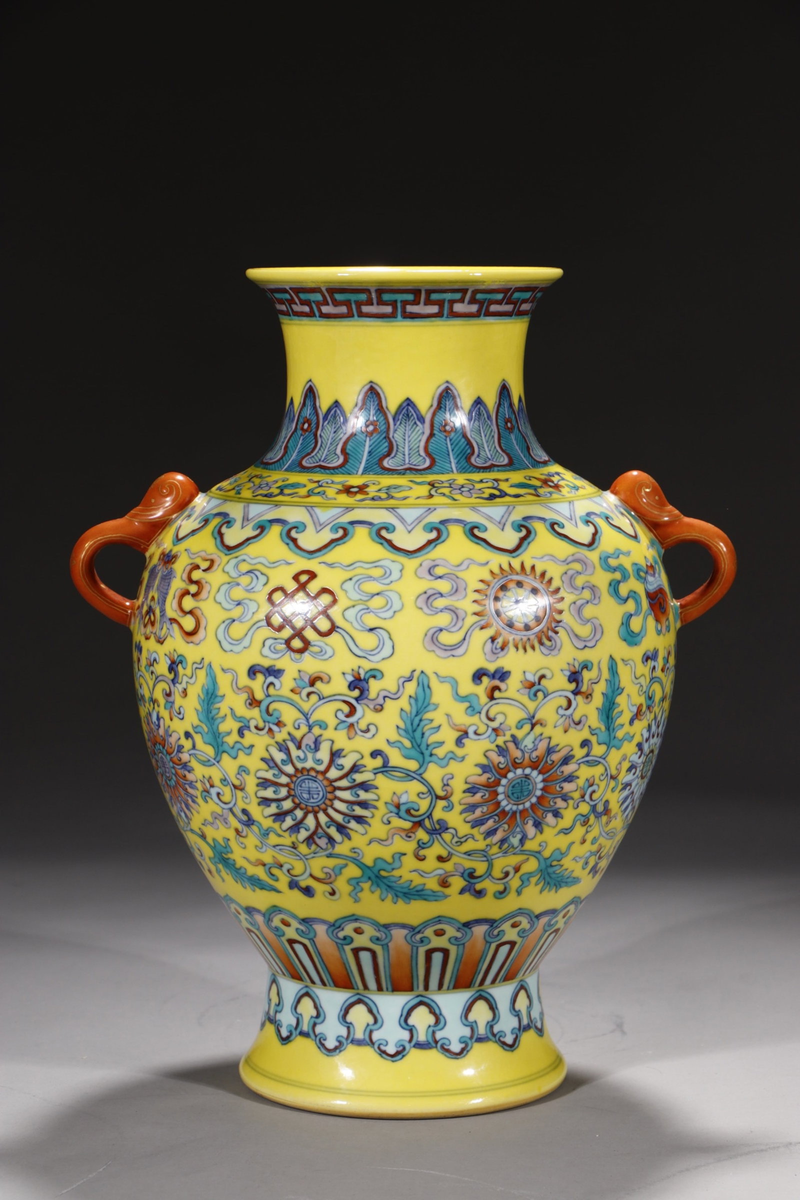 An Exquisite Yellow Ground Doucai Lotus and Eight Treasures Pattern Double-Ears Vase: An Exquisite Yellow Ground Doucai Lotus and Eight Treasures Pattern Double-Ears Vase,Qing Dynasty,China,Qianlong Six-character Mark,Size:11.4in 黄地斗彩缠枝莲