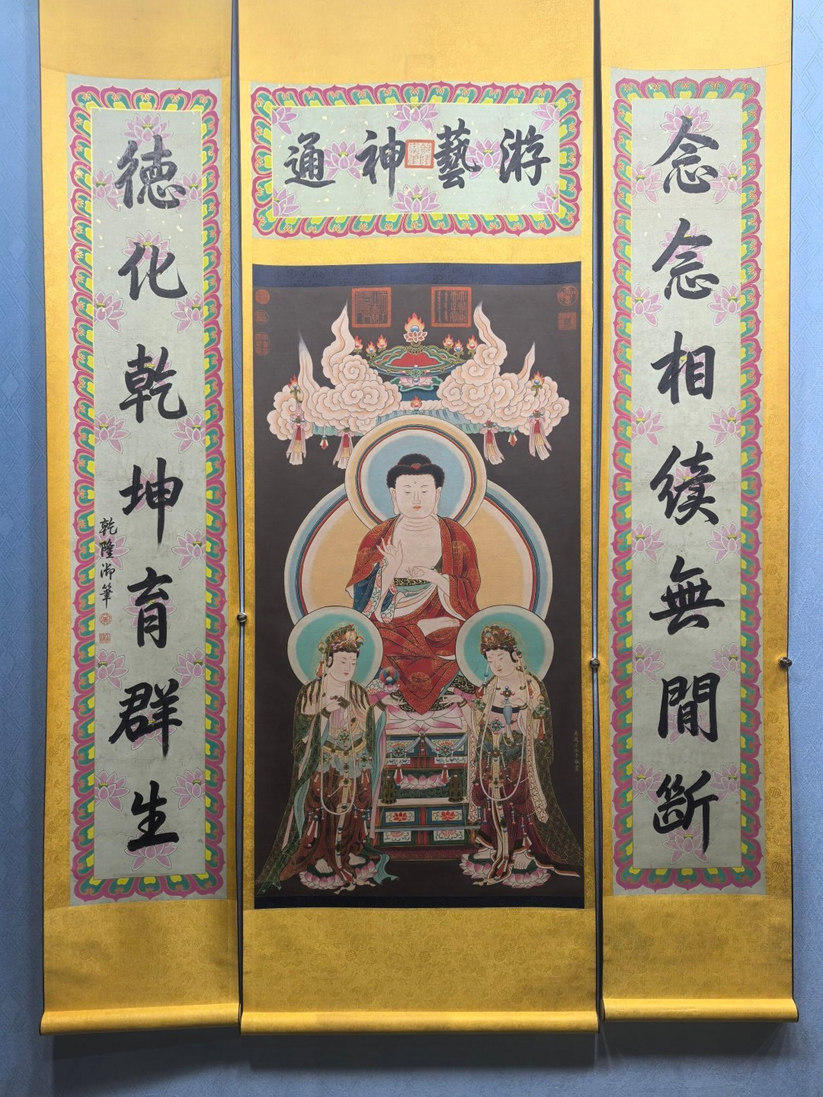 A Chinese Vertical Scroll Ink Painting of Buddha Statue on Silk,With A Chinese Vertical Scroll Ink: A Chinese Vertical Scroll Ink Painting of Buddha Statue on Silk,With A Chinese Vertical Scroll Ink Calligraphy Couplet on Paper,Wu Daozi,Size:(Without frame)25.4inx47.2in,(对联)11.8inx47.2