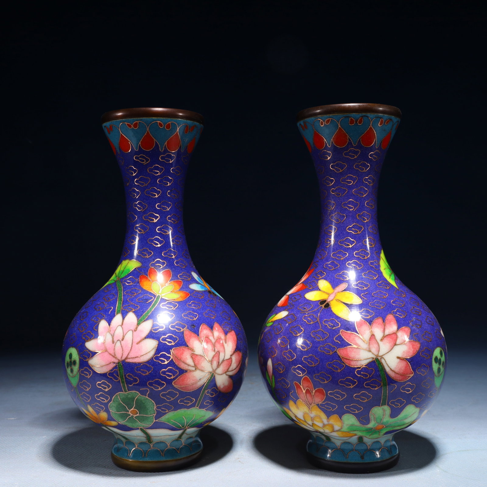 A Pair of Exquisite Cloisonne Lotus Butterfly Pattern Vases: A Pair of Exquisite Cloisonne Lotus Butterfly Pattern Vases,Qing Dynasty,China,Qianlong Four-character Mark,Size:7.9inx4.3inx4.3in,Weight:1650g 一对景泰蓝莲花
