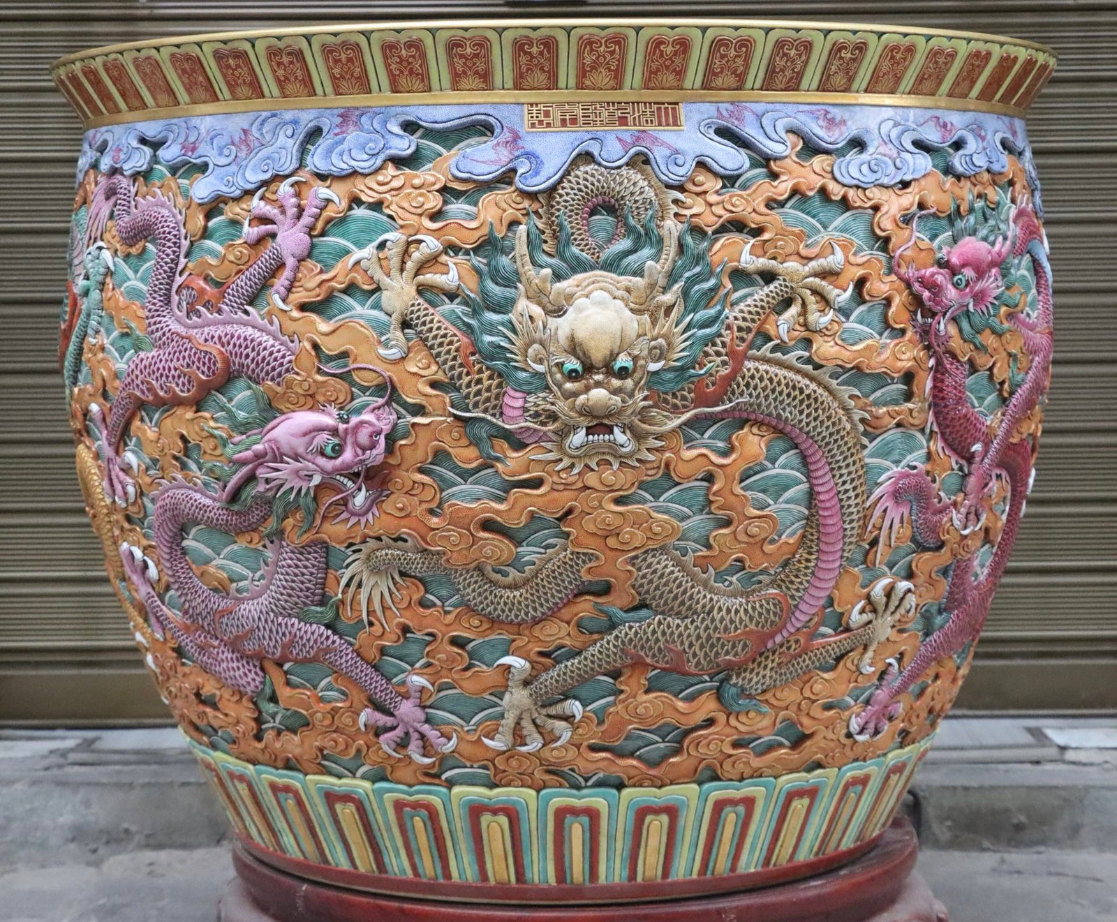 A Huge Famille-Rose Seawater Auspicious Cloud and Dragon Pattern Vat: A Huge Famille-Rose Seawater Auspicious Cloud and Dragon Pattern Vat,Qing Dynasty, China,Qianlong Six-character Mark,Size:26.4inx33.5inx22in