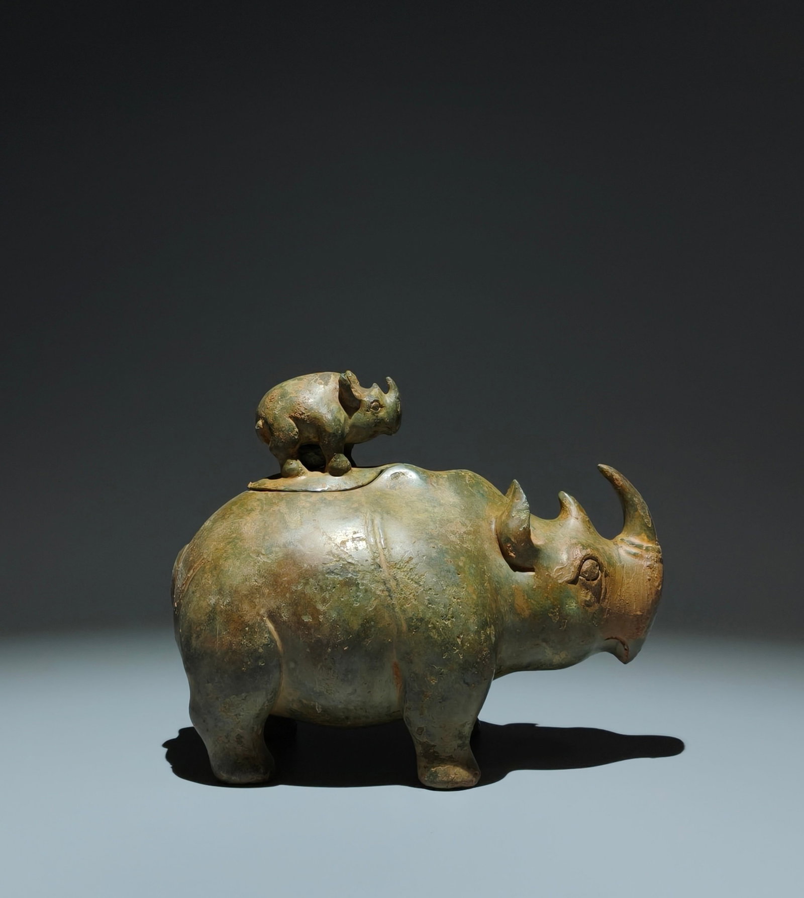 An Archaic Bronze Rhinoceros-Shaped Food Vessel: An Archaic Bronze Rhinoceros-Shaped Food Vessel,the Warring States period in China,Size:6.7inx8.1inx4.5in