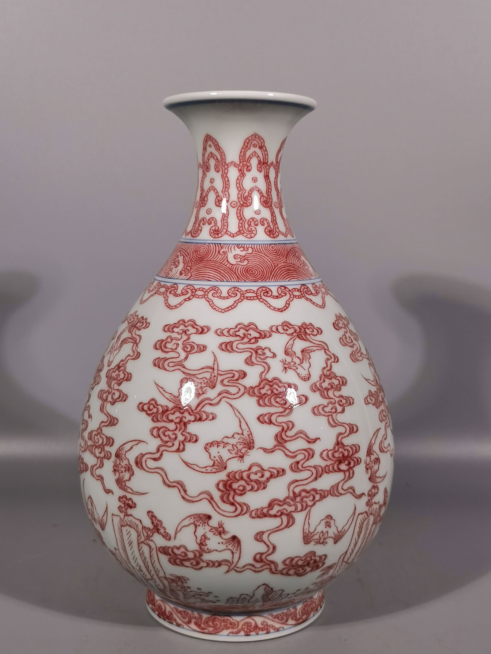 An Exquisite Underglaze-Red Auspicious Cloud and Bats Pattern Vase: An Exquisite Underglaze-Red Auspicious Cloud and Bats Pattern Vase,Qing Dynasty, China,Qianlong Six-character Mark,Size:9.6inx2.8inx5.9in 釉里红祥云蝙蝠ಬ