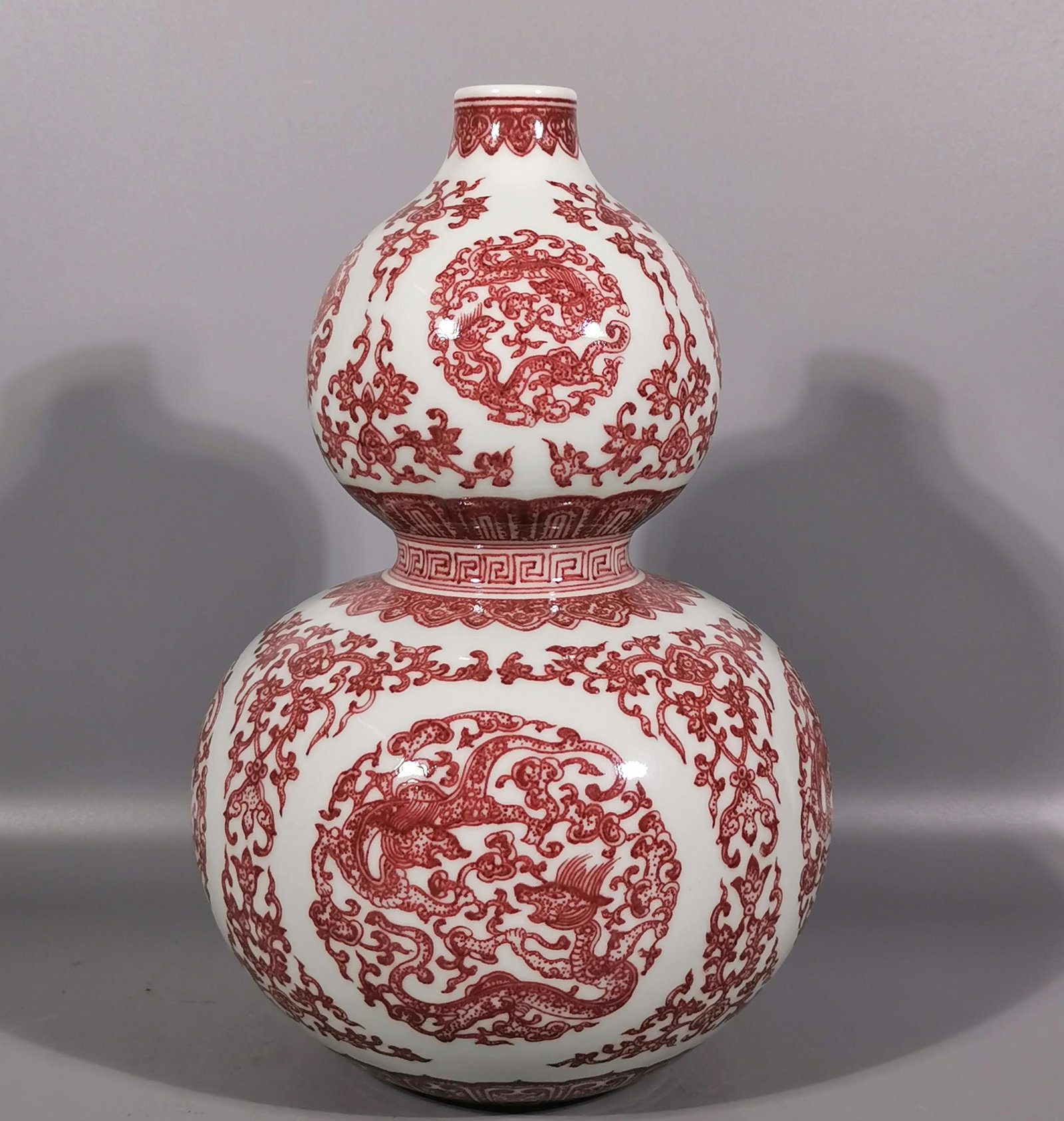 An Exquisite Underglaze-Red Lotus and Dragon Pattern Gourd-Shaped Vase: An Exquisite Underglaze-Red Lotus and Dragon Pattern Gourd-Shaped Vase,Qing Dynasty, China,Qianlong Six-character Mark,Size:11.2inx7.2in