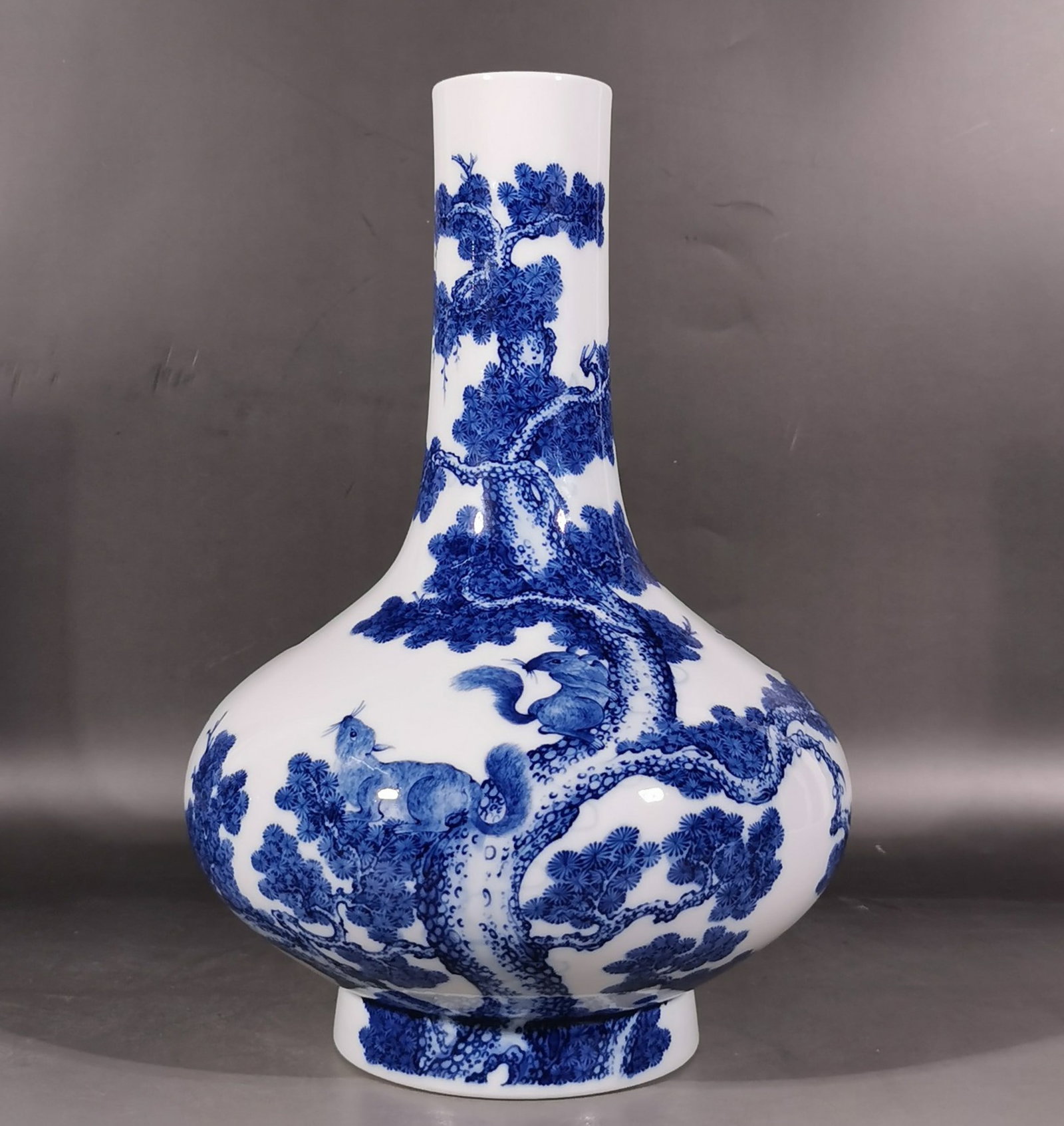 A Rare Blue and White Pine and Squirrel Pattern Vase: A Rare Blue and White Pine and Squirrel Pattern Vase,Qing Dynasty, China,Yongzheng Six-character Mark,Size:13.1inx2.4inx8.9in 青花松鼠松树纹瓶,中&