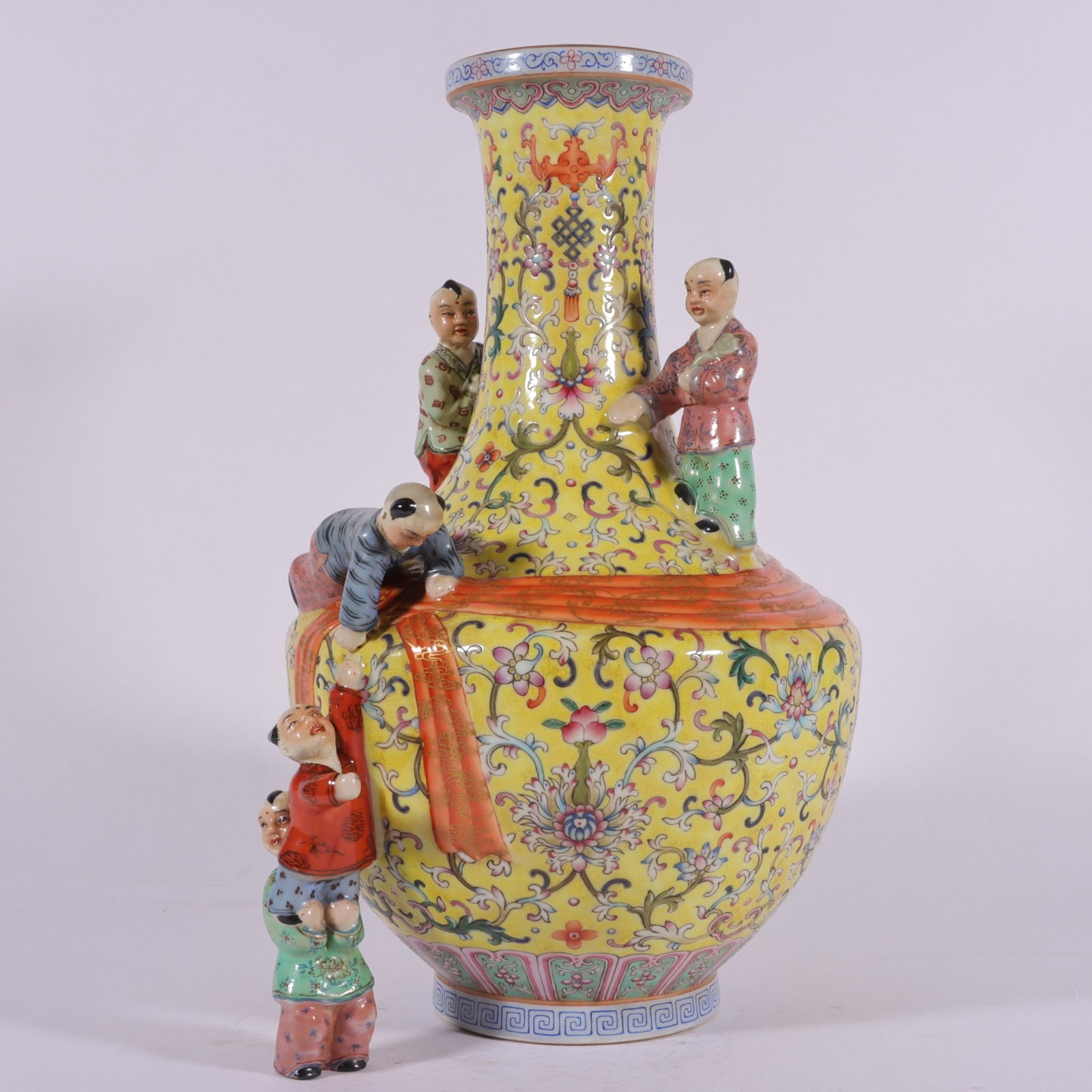 A Rare Famille-Rose Yellow Ground Painted Gold Lotus and Figure Pattern Vase: A Rare Famille-Rose Yellow Ground Painted Gold Lotus and Figure Pattern Vase,Qing Dynasty, China,Qianlong Four-character Mark,Size:14.4inx3.7inx9.4inx4.3in 粉彩黄地描%