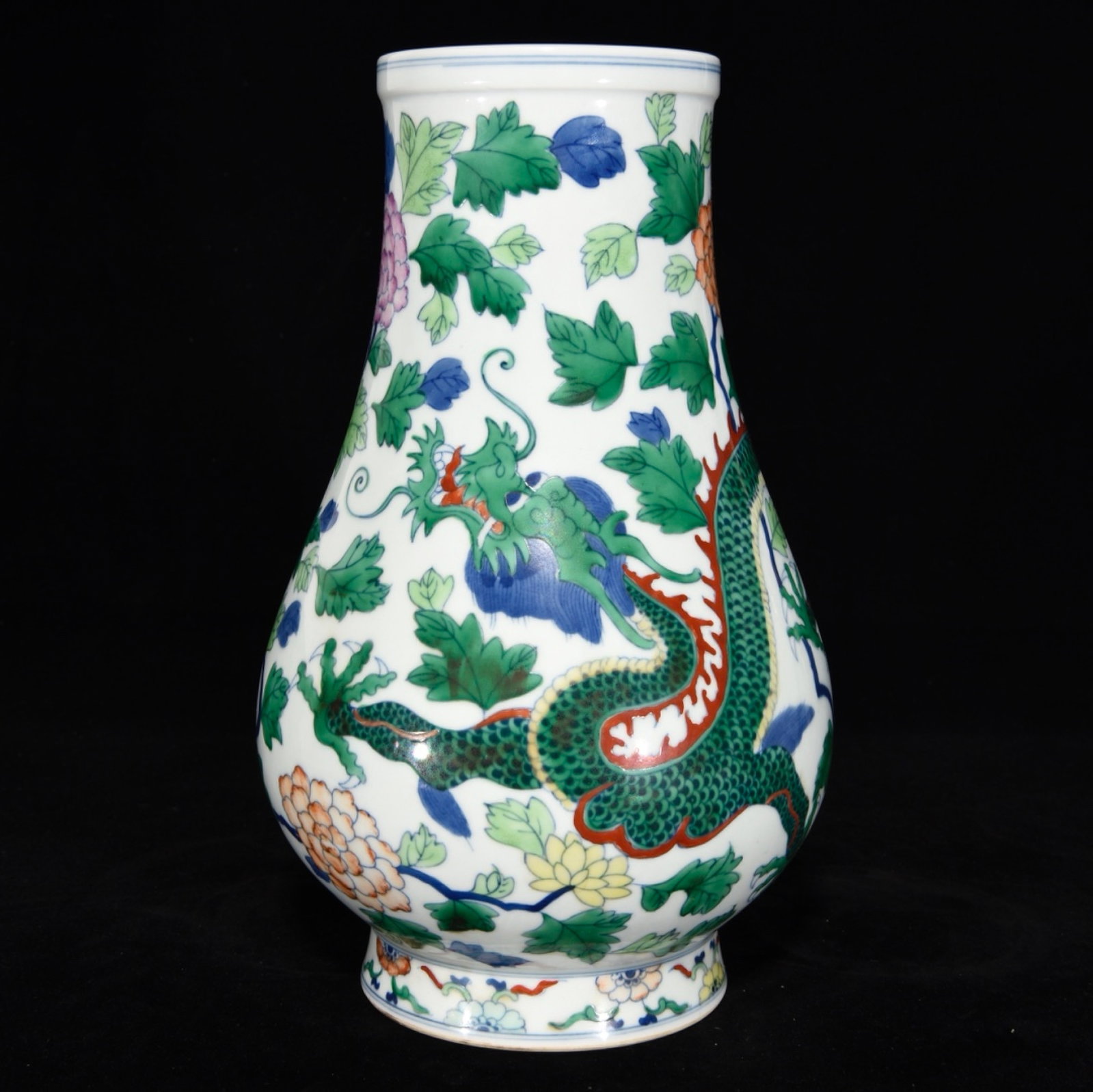 A Rare Doucai Flower and Dragon Pattern Vase: A Rare Doucai Flower and Dragon Pattern Vase,Qing Dynasty, China,Qianlong Six-character Mark,Size:11.8inx7.5in 斗彩花卉龙纹瓶,中国清代